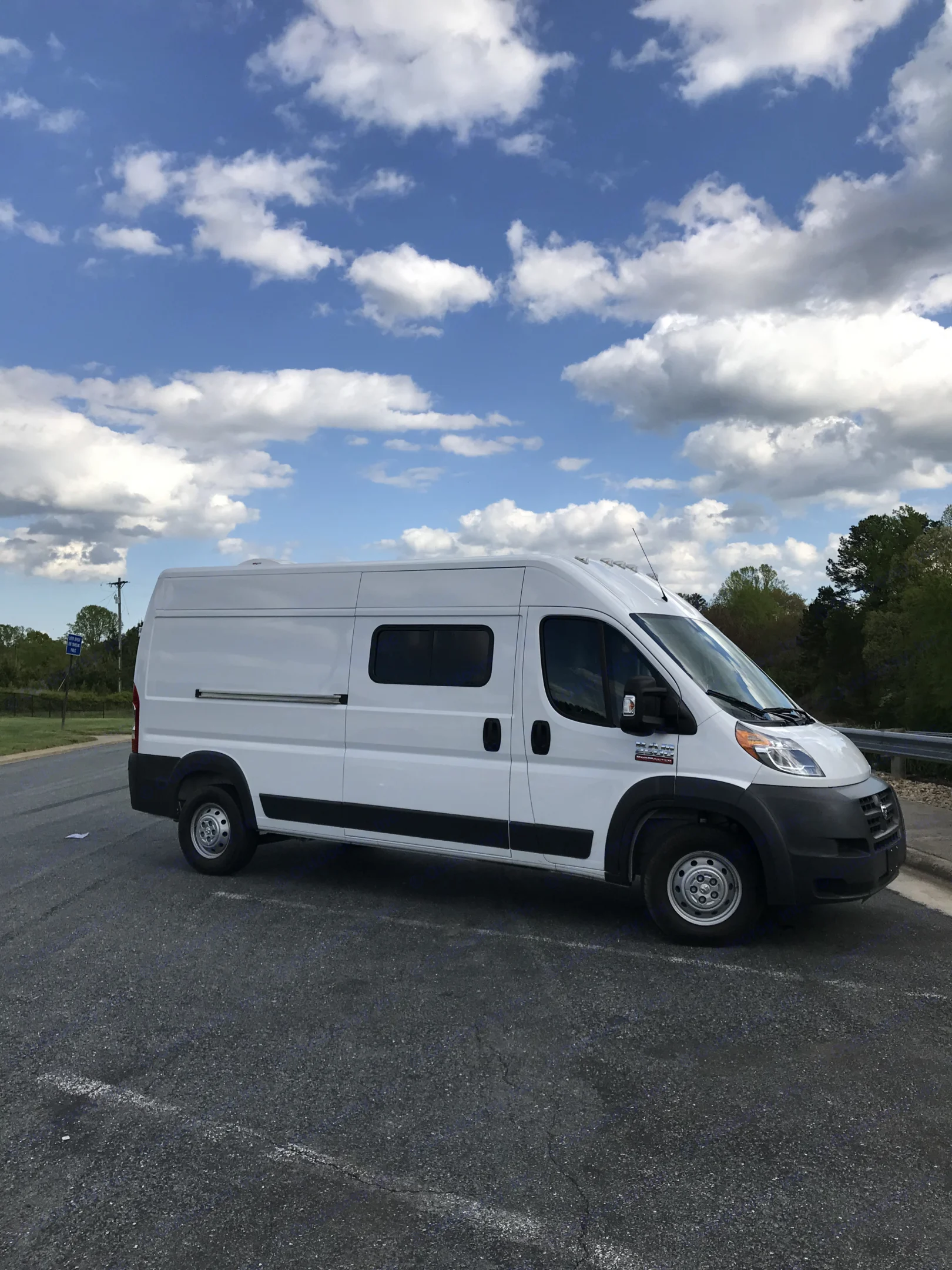 one side has the window you see in the photo and the other has no windows. The water port and the shore power are on the drivers side.. Ram Promaster 2500 2017