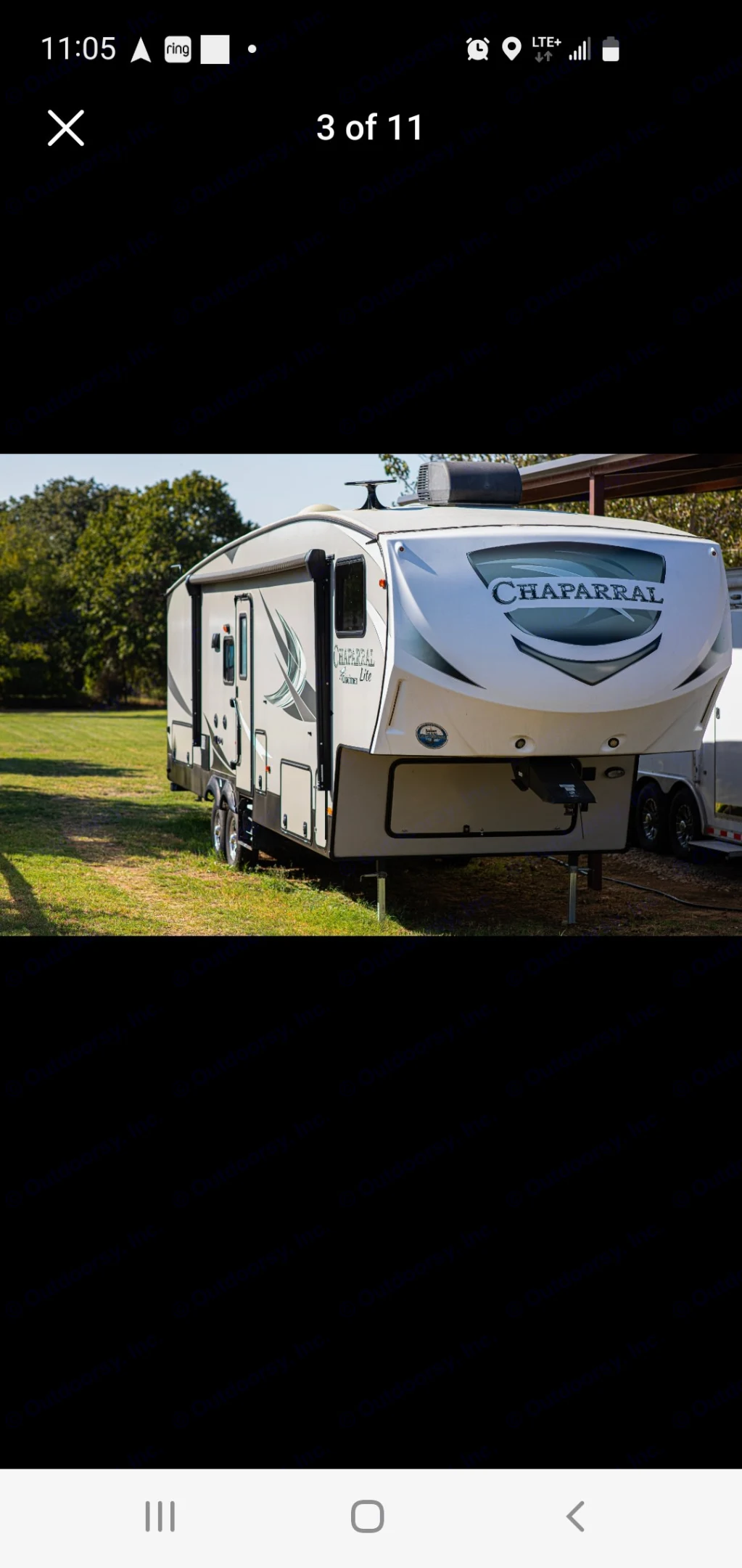 This Chaparral fifth-wheel RV is ready for your next rv rental adventure, parked on green grass.. Coachman Chapperal 2018