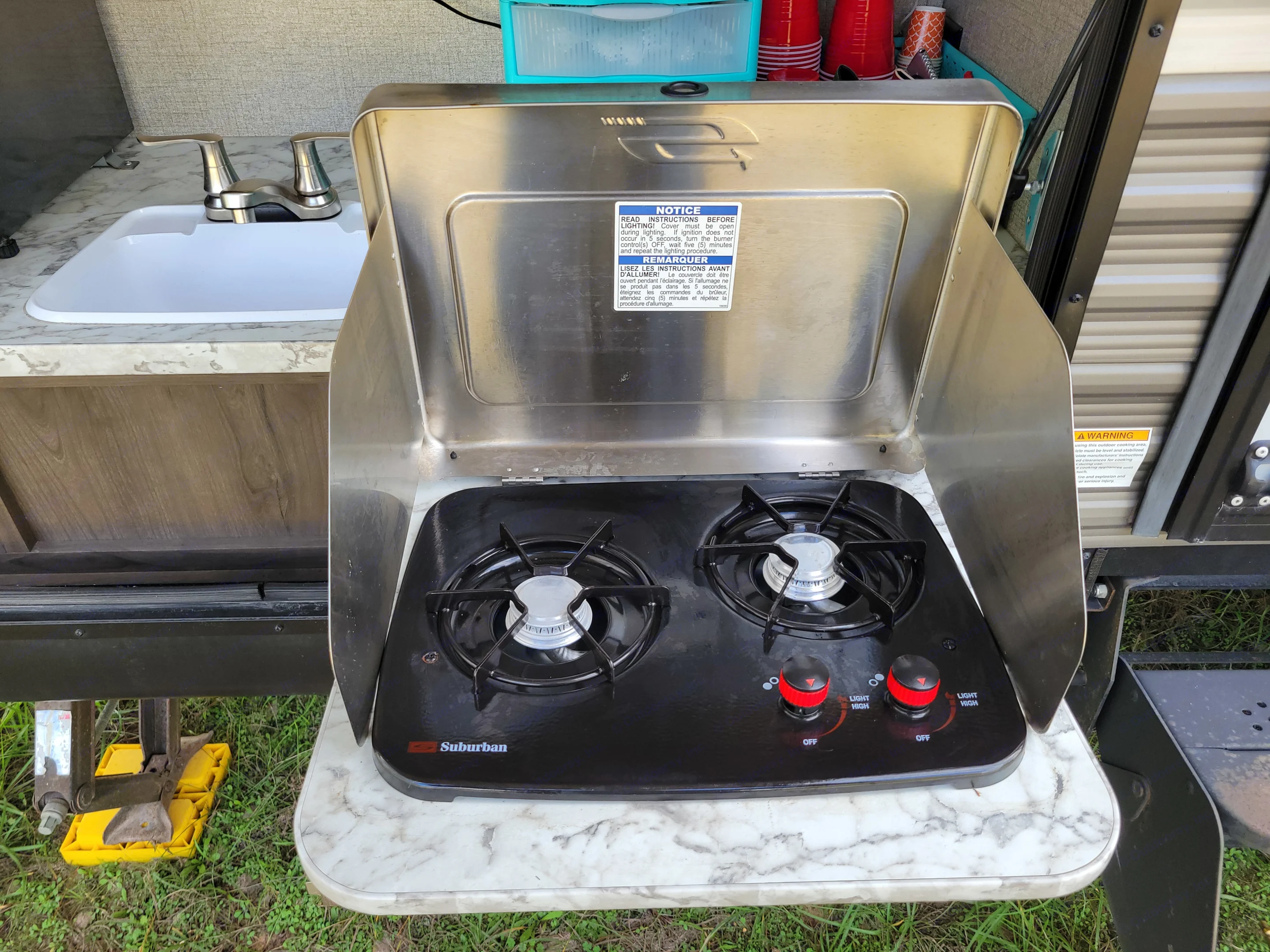 An outdoor kitchen, complete with a two-burner Suburban. Jayco Jay Flight SLX 2021