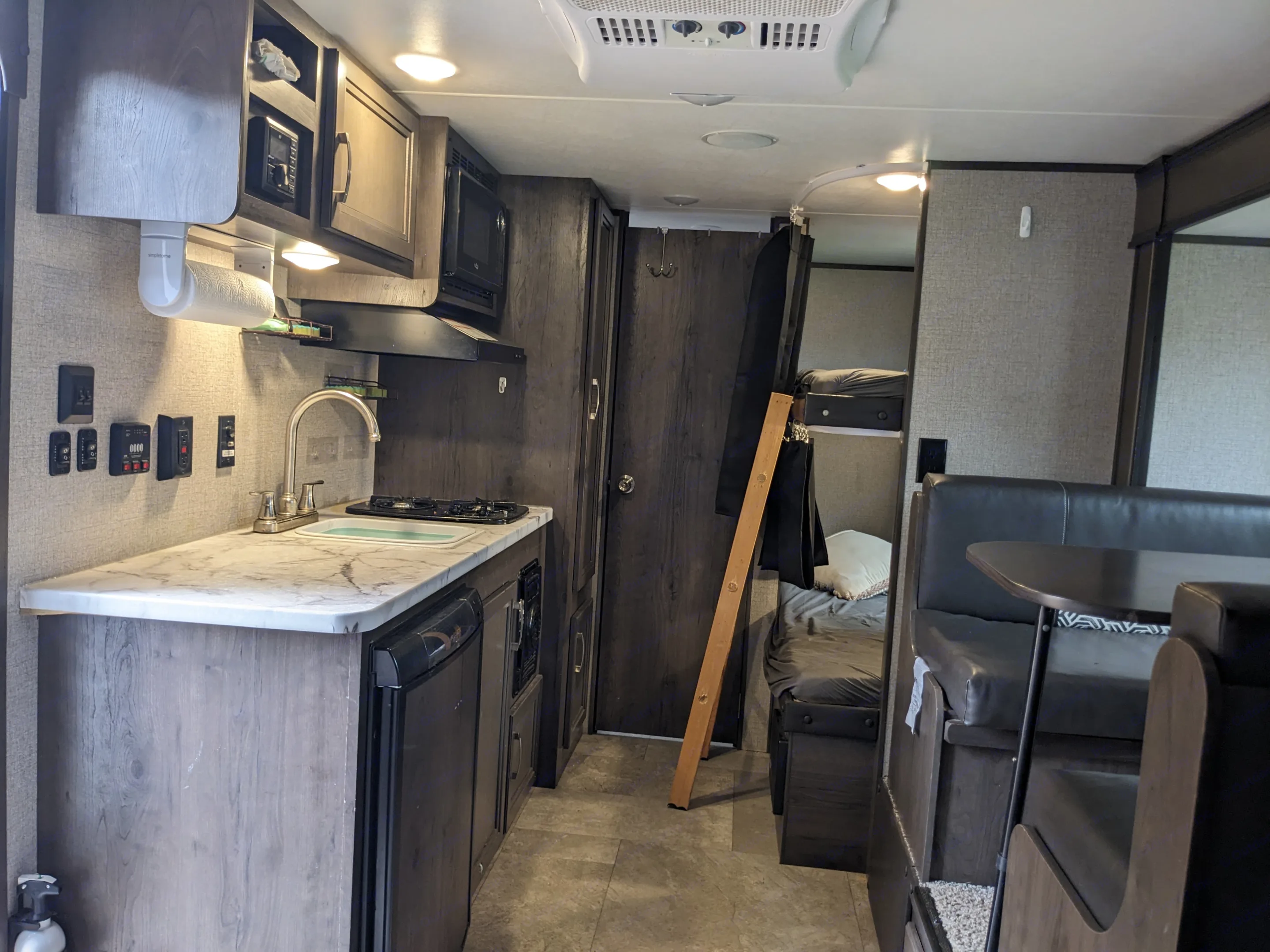 From the queen bed at the front of the camper, looking towards the back. Kitchen on left, dinning room on right, bathroom door straight back, bunk beds beside that. . Jayco Jay Flight SLX 2020