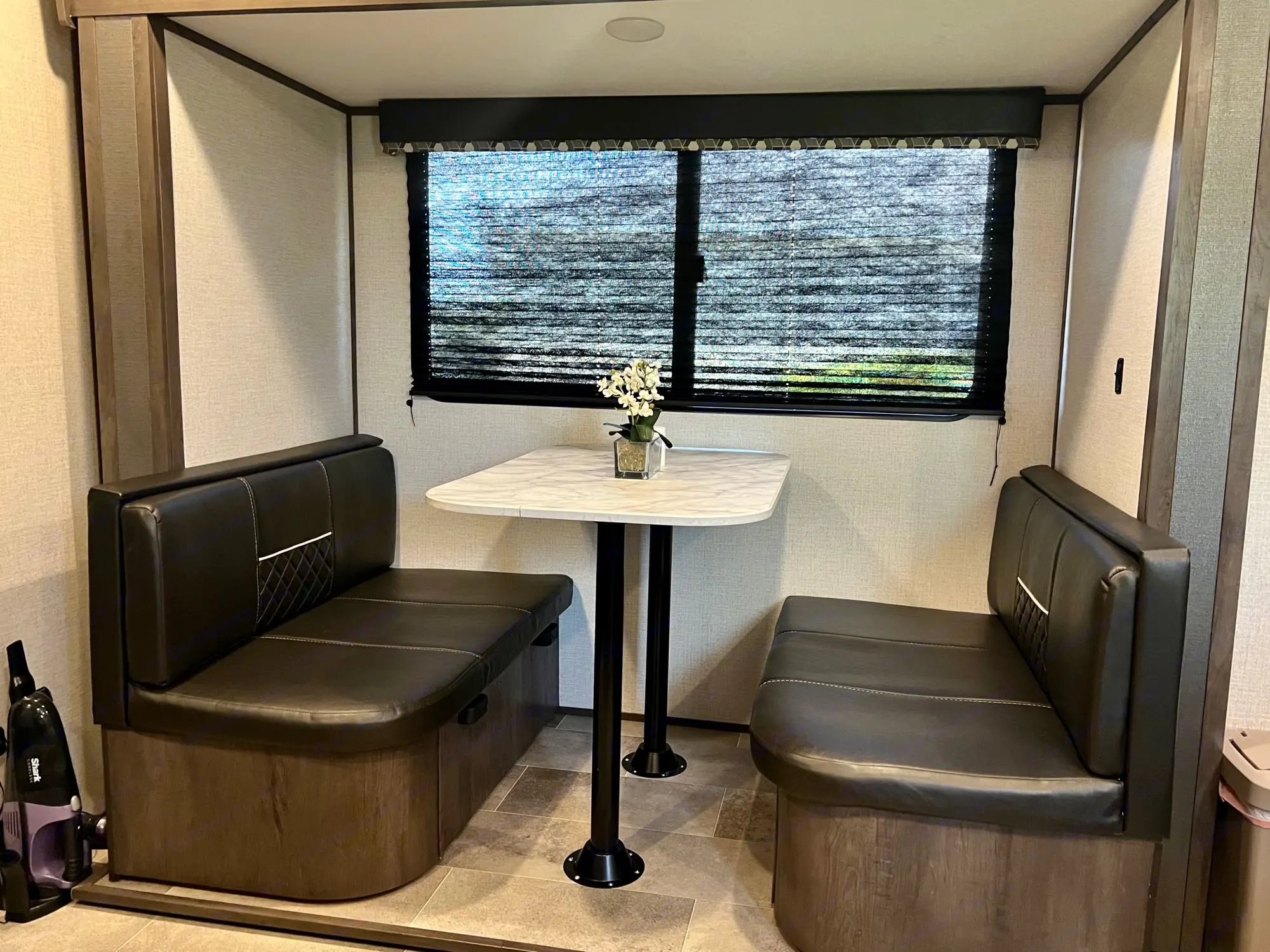 Dining room table, turns into bed and has storage under each batch. Dutchmen Coleman Light LX 2021