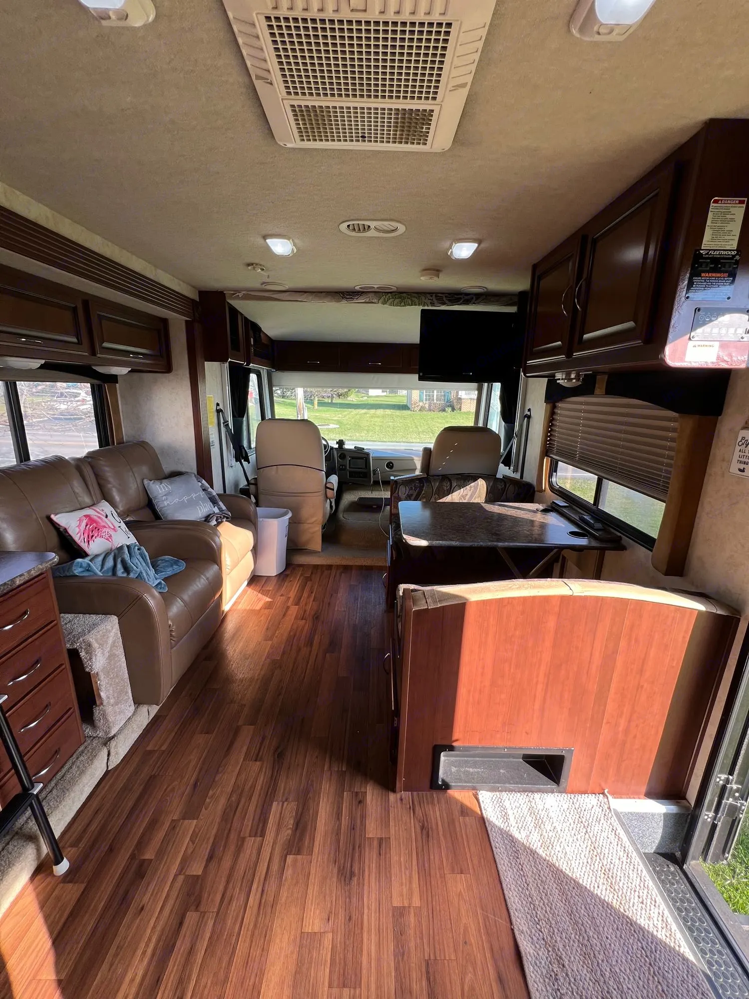 Main living area w/ two recliners, dinette that converts to bed, a flat screen TV, plenty of storage and windows for natural light or a nice breeze.. Storm Storm Motorhome 2011