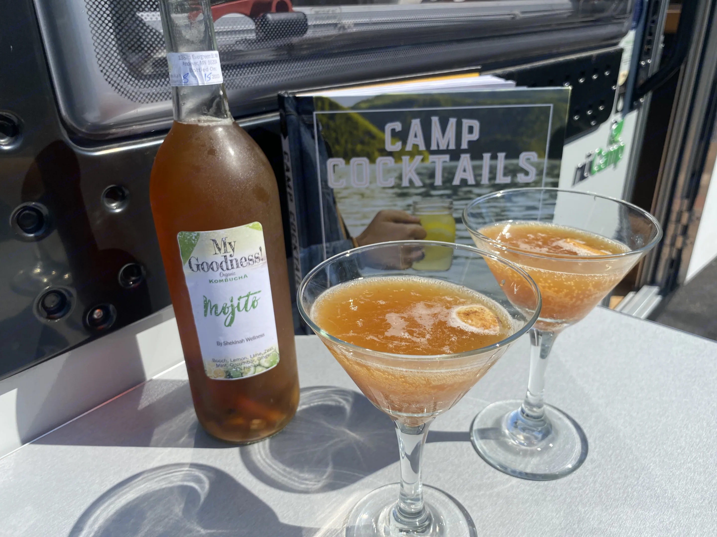 Cocktail height table setup on the outside front of Sun-Chaser makes relaxation and socializing an enjoyable and easy event.. nuCamp T@B 2019