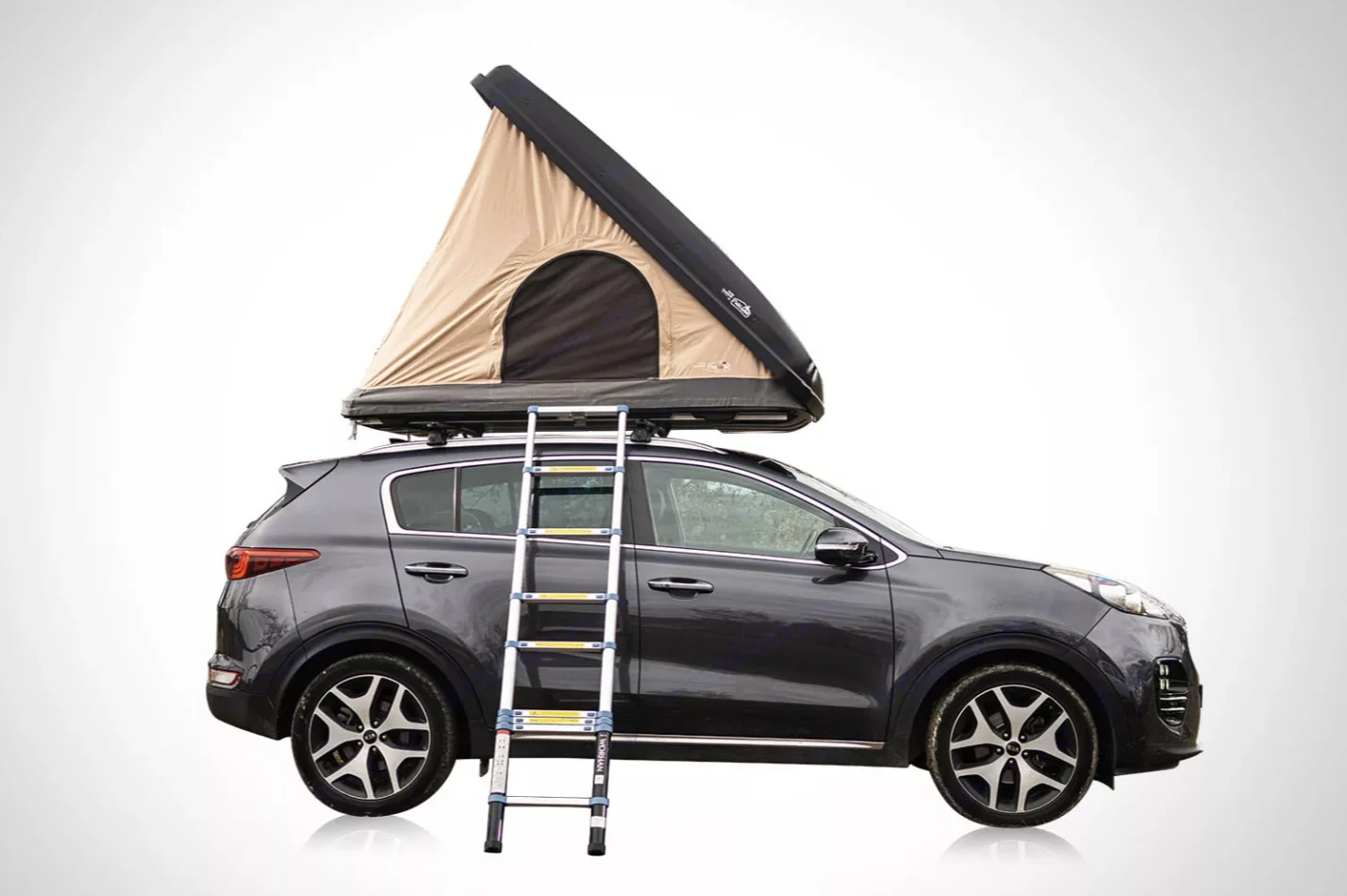Modern SUV with a pop-up rooftop tent and ladder, an ideal RV rental option for car camping & adventures.. NaïtUp Duö 2024