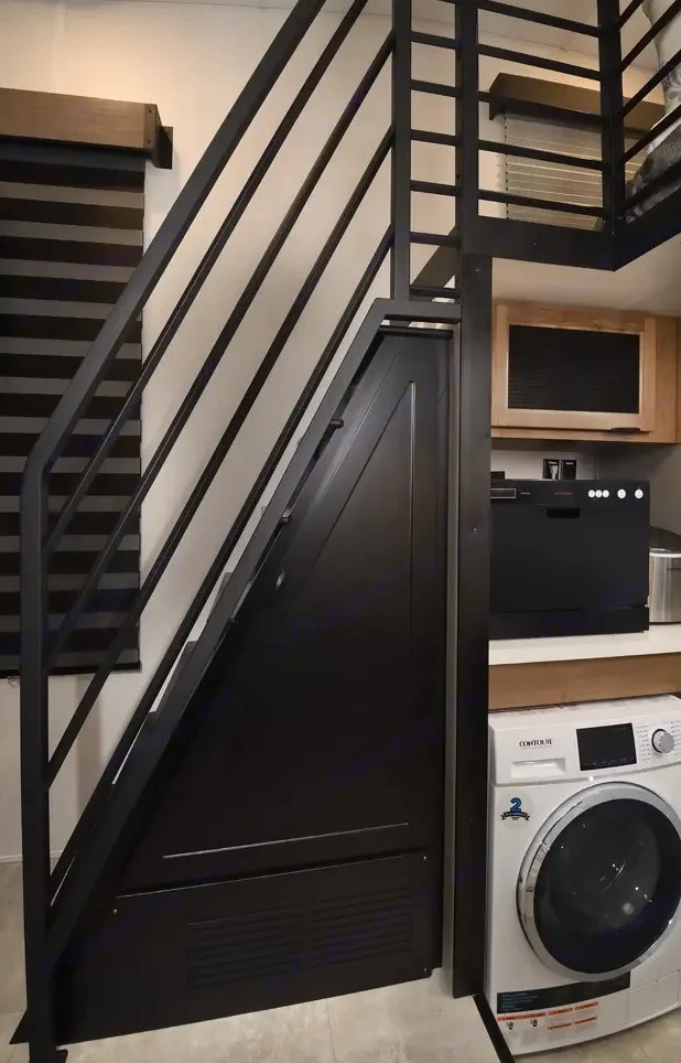 RV rental: Compact interior with black metal loft staircase, kitchen including dishwasher and washing machine for efficient living.. Forest River Timberwolf 16ML 2024