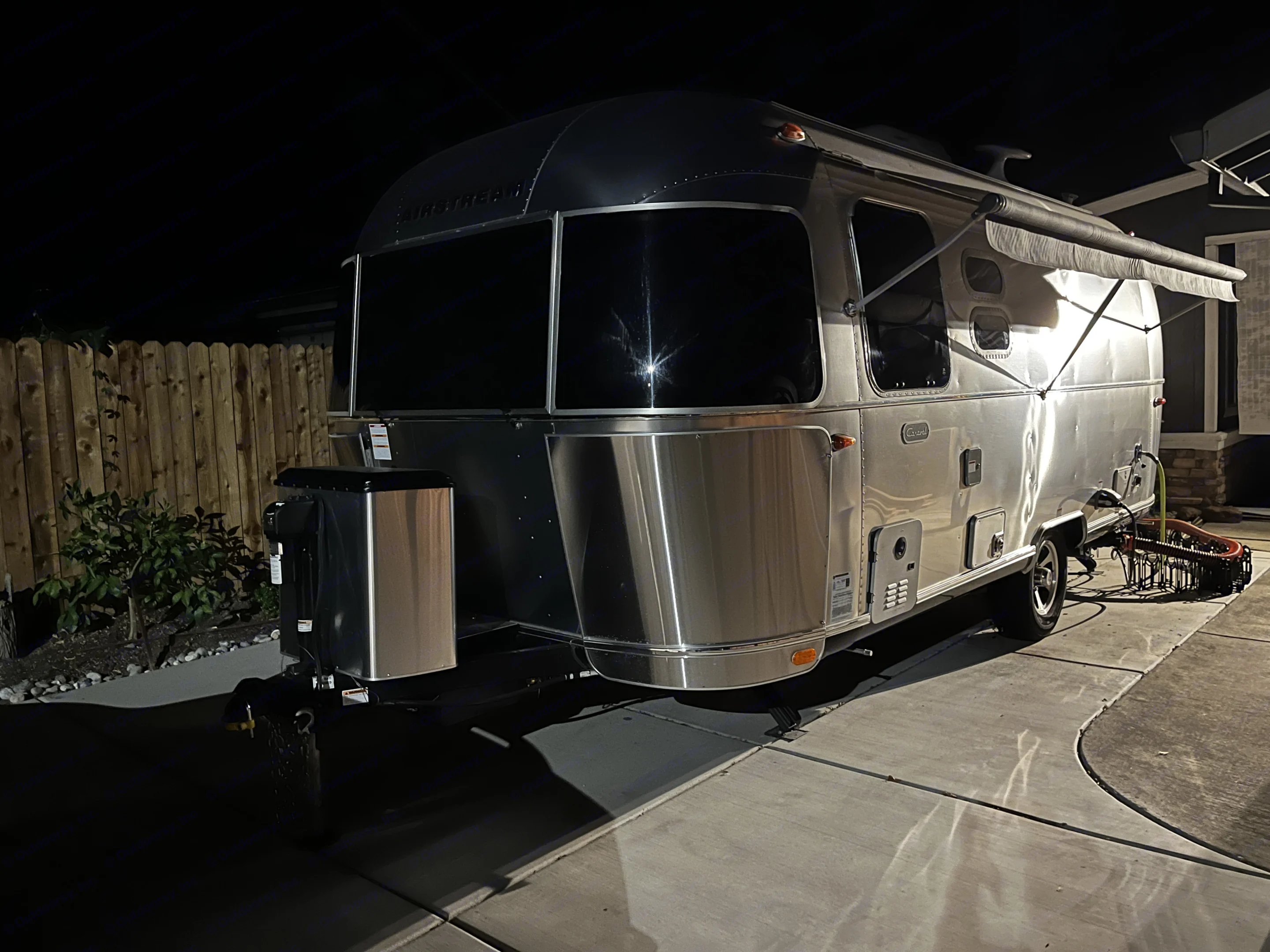 There are awnings on both sides. The exterior shower is on this side.. Airstream Caravel 2021