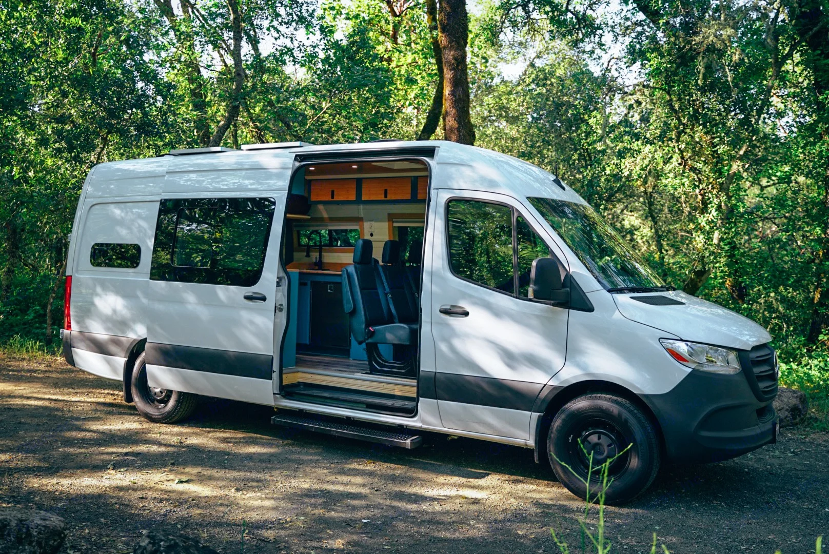 Welcome in to the Carmel, our family van! Step inside, where cozy comfort meets adventure. The warm, inviting layout is designed with families in mind, featuring second row seating, and clever storage solutions. Whether you're relaxing after a day of exploring or preparing a family meal, Carmel offers everything you need for unforgettable road trips and quality time together.. Mercedes-Benz Sprinter 2024
