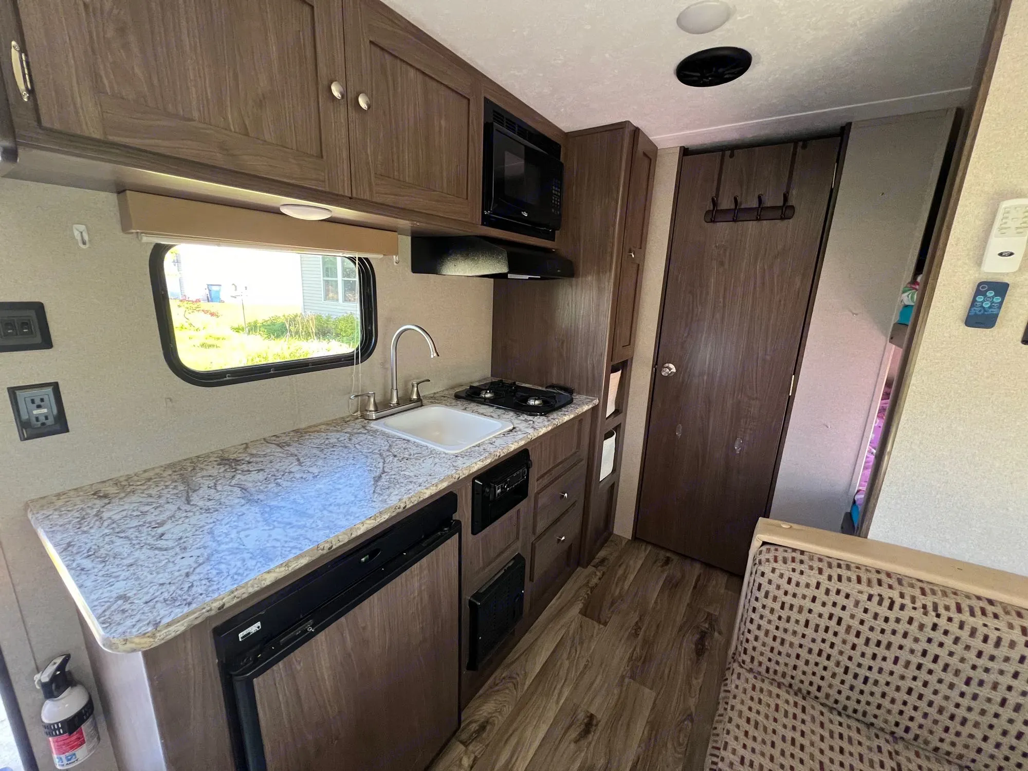 Sink, two burner stove, pantry, mini fridge . Keystone RV Hideout LHS 2019