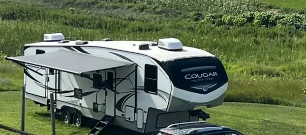 A white Cougar fifth-. Keystone RV Cougar 2020