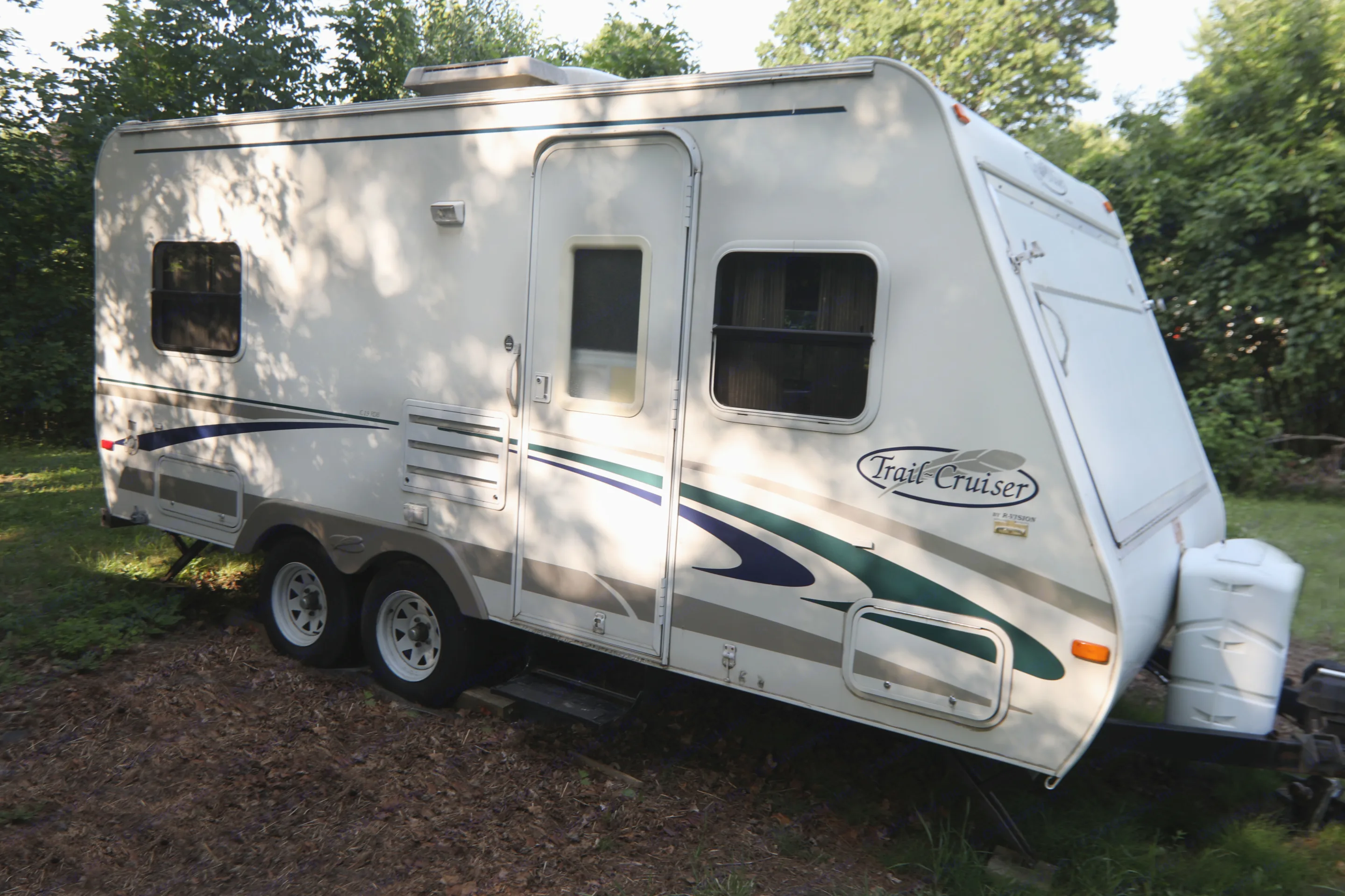 Our R-Vision Trail-Lite Trail Cruise travel trailer is light enough for a medium size SUV to pull it empty, but large enough for the whole family to fit comfortably in it.. R-Vision Trail-Lite Trail-Cruiser 2003