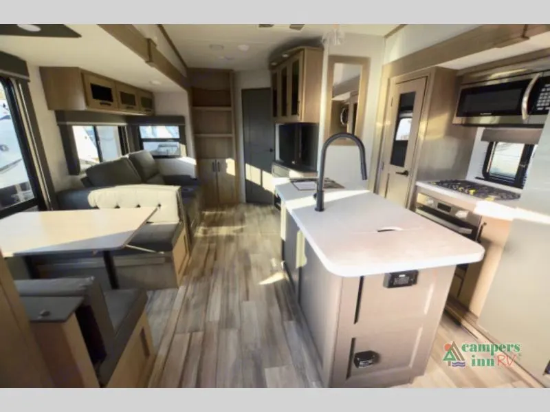 Explore this bright rv rental! Features a modern kitchen island, spacious dinette, and comfortable sofa in the living area.. Grand Design Reflection 2023