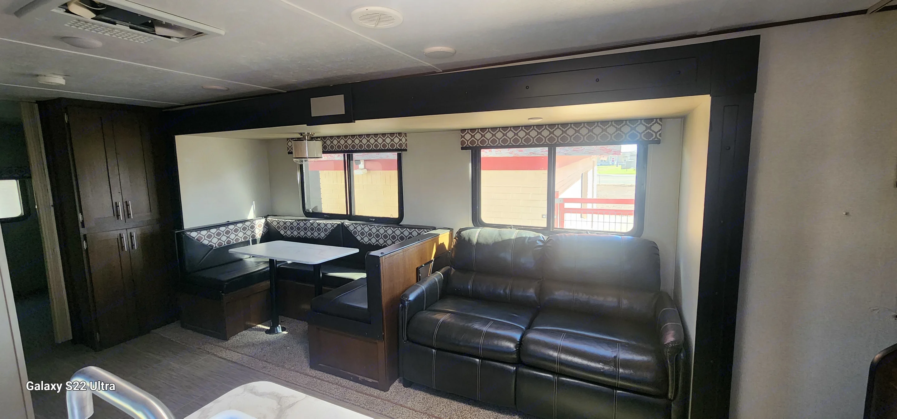 Livingroom area, couch will pull out to a full-size bed, dinette can be converted into sleeping area. . Forest River Tracer Breeze 2019