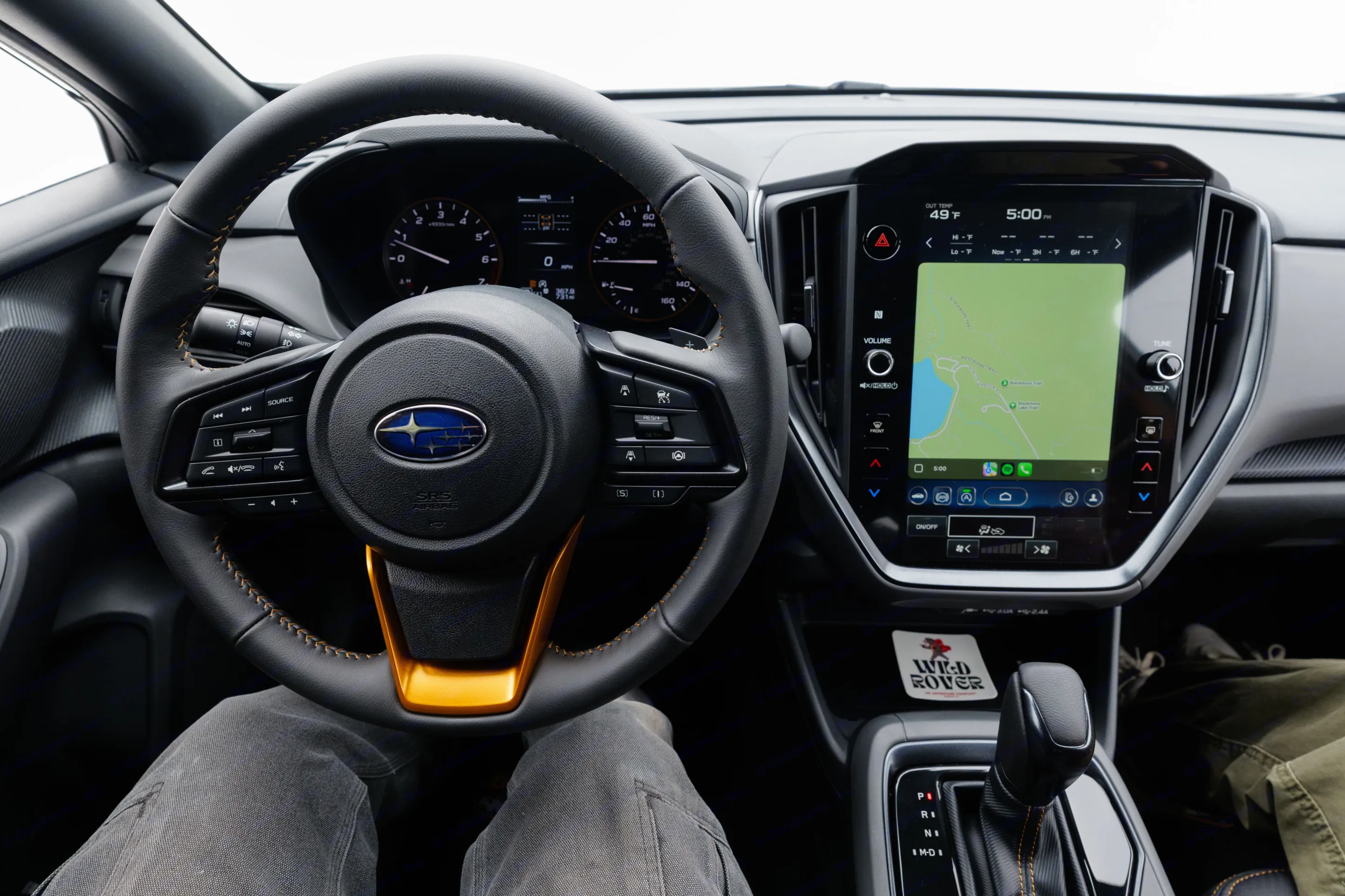 Inside a Subaru, showing the steering wheel, dash, and infotainment. Ideal vehicle for your next rv rental adventure!. Subaru Crosstrek Wilderness 2025