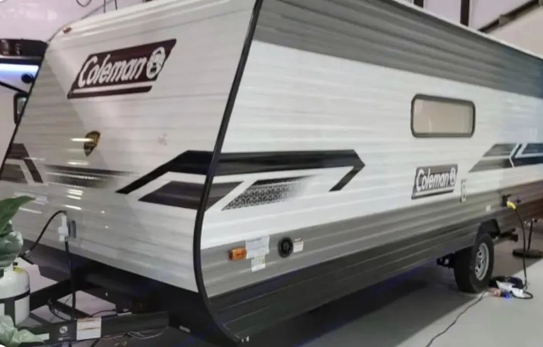 A modern Coleman travel trailer, an excellent RV rental option. This white and grey camper is ideal for adventures.. Dutchmen Coleman Lantern LT 2021