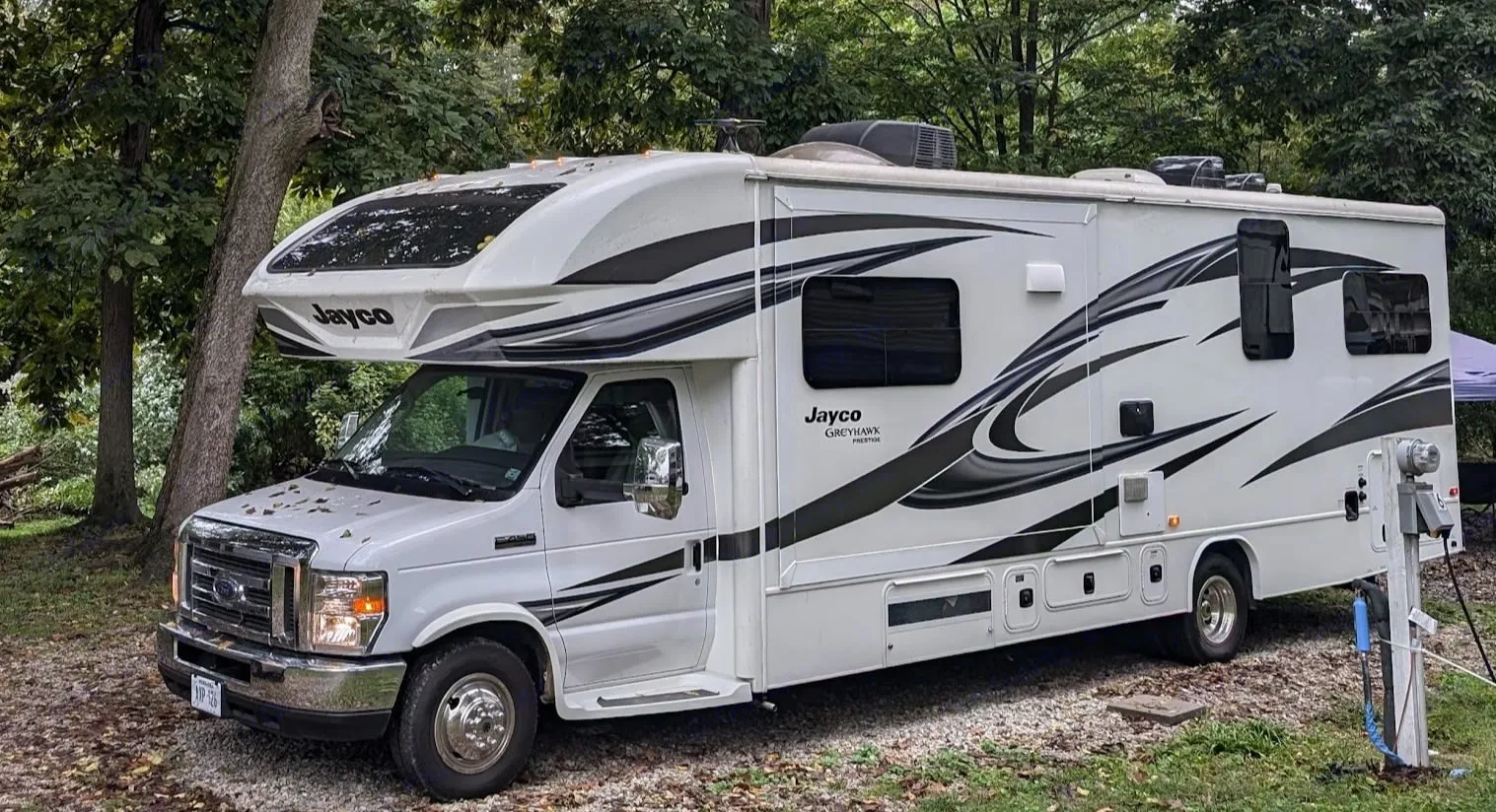 She's a beaut! You can see that the exterior glass is tinted so nobody can see into the RV when you're inside. Also make note of the many windows - provides excellent natural light on the interior.. Jayco Greyhawk Prestige 2018