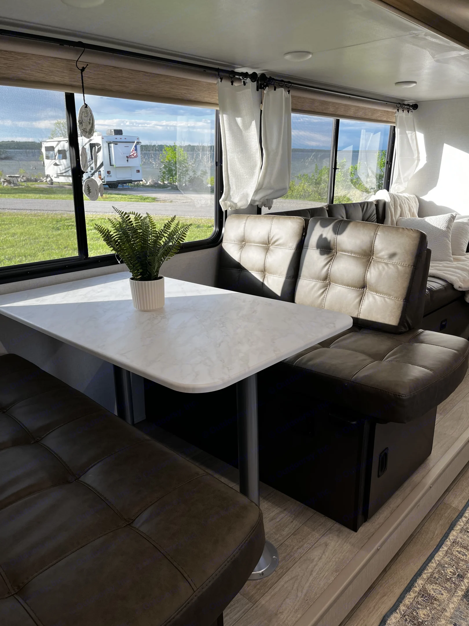 Watch the world come awake over coffee from the windows of the spacious dinette, which seats 4. Dinette table doubles as a work space and sleeping area. When converted, it can sleep 1 adult (2 if you don’t mind being cozy) or 2 children. There are storage bins below the dining seats. Bedding and towels are stowed on one side while the other is empty and ready to hold guest items. . Salem Cruise Lite 26ICE 2025