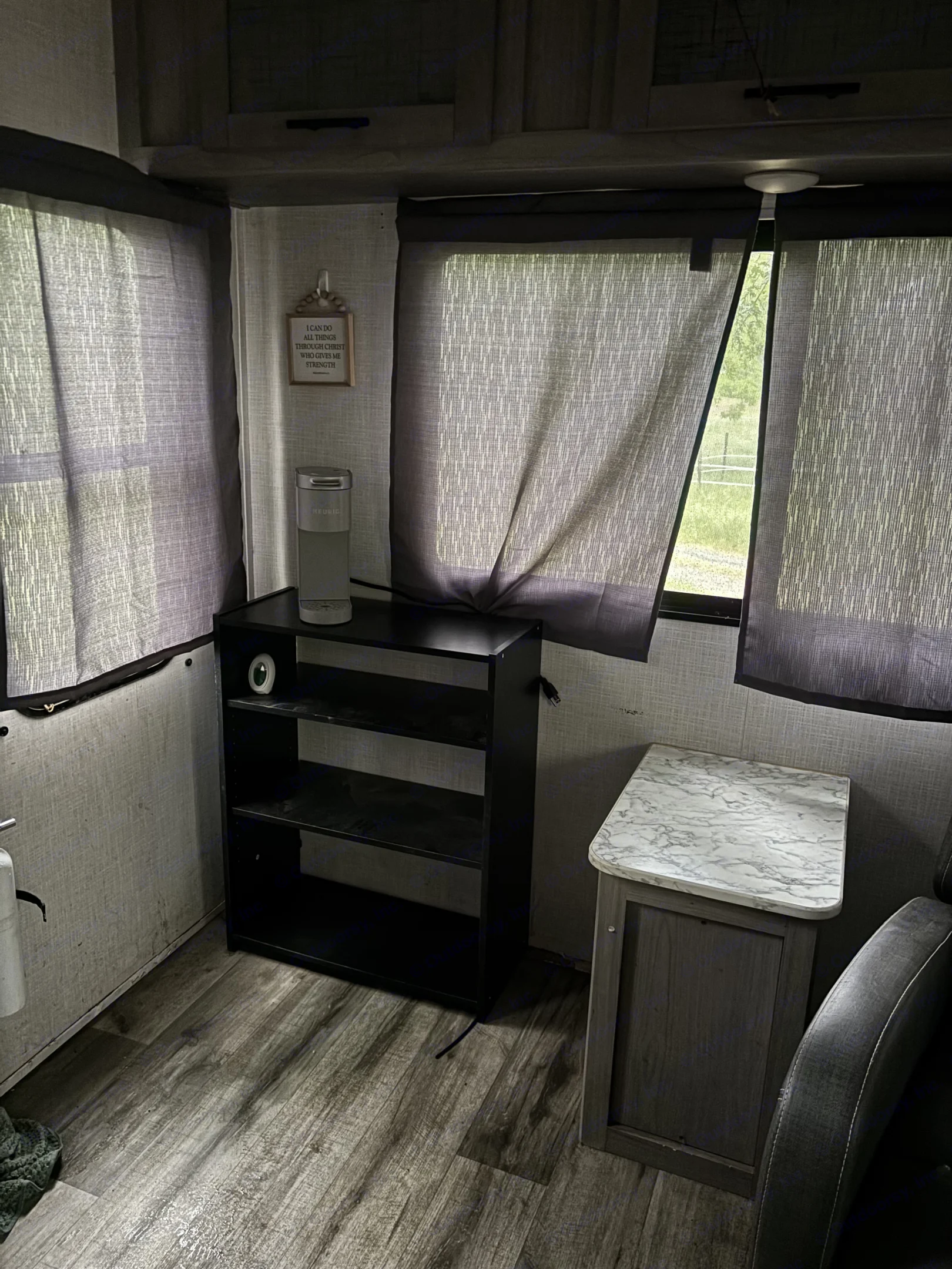 RV rental's cozy interior: coffee maker on shelves,. Dutchmen Coleman Light 2022