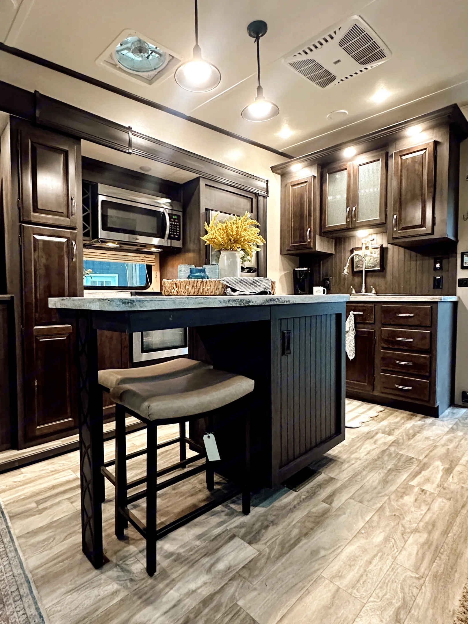 Well-appointed kitchen. Large center island with bar seating and ample counter space.. Forest River Shasta Phoenix 2020