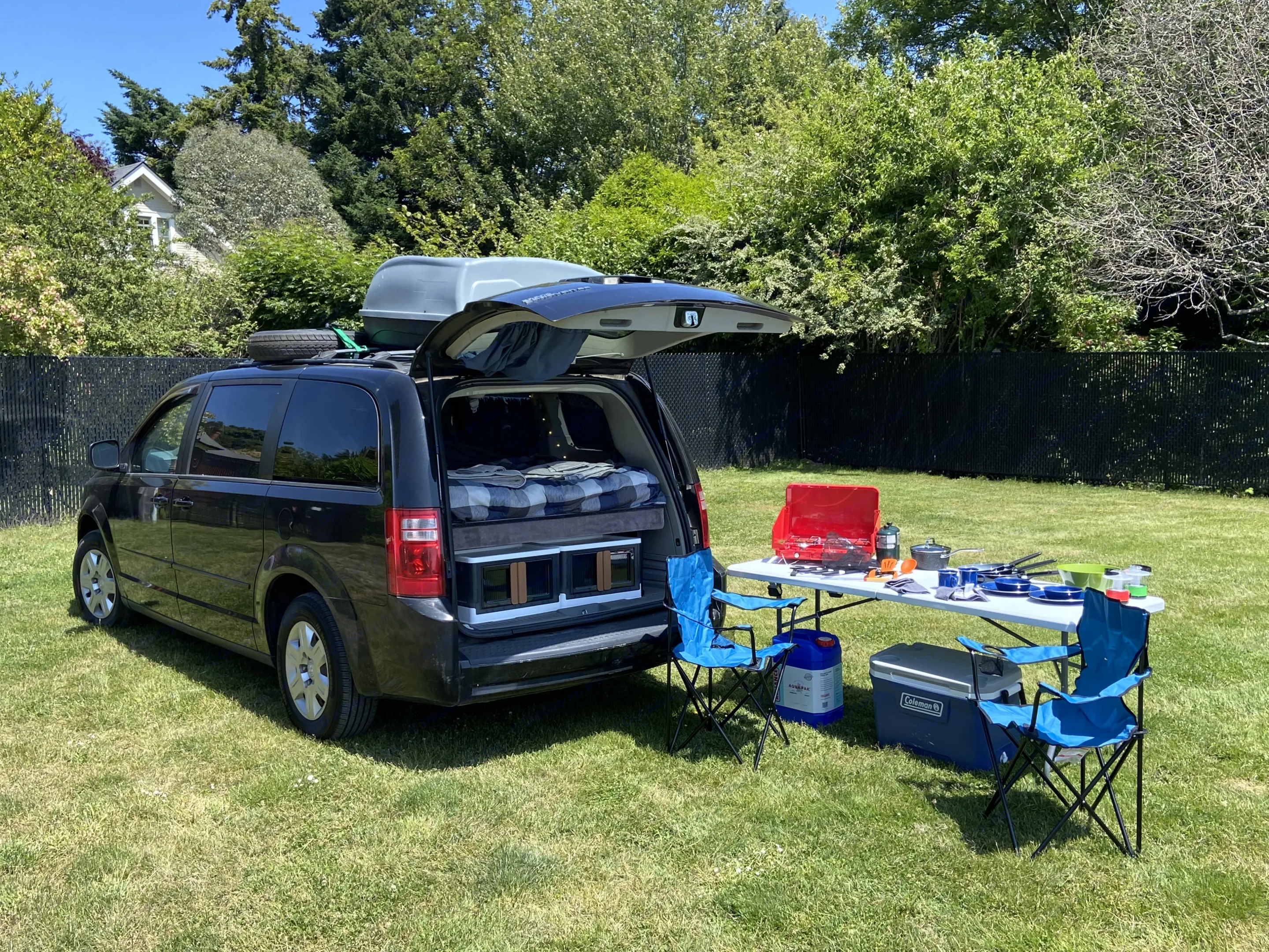 Experience adventure with this minivan RV rental. Features a comfy bed, outdoor kitchen, and camping gear for your trips.. Dodge Grand Caravan 2008