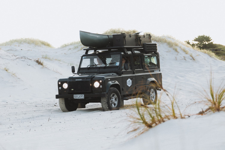 compact jeep vehicle that has an overhead bell tent