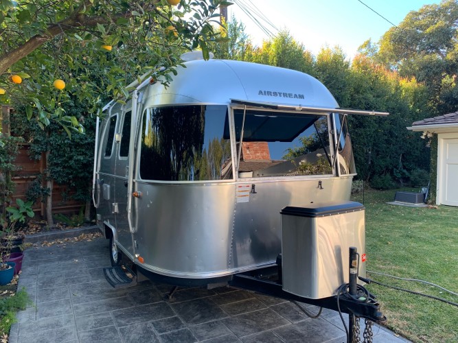 fully loaded airstream with an outside shower