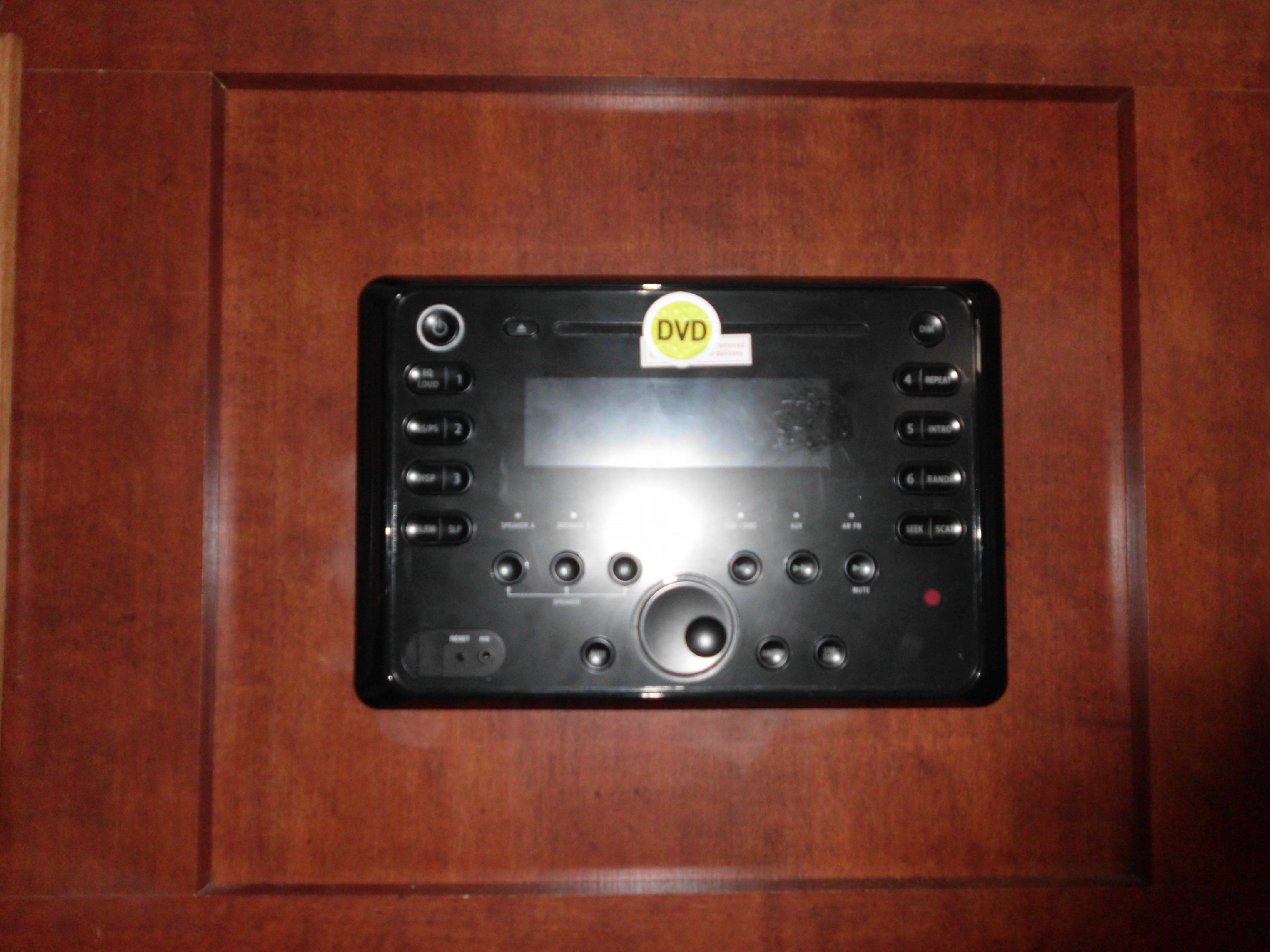 RV rental: Built-in black stereo/DVD entertainment system with various audio, DVD, and radio controls in a wooden panel.. Salem Cruise Lite 2017