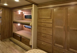 Experience family comfort in this RV rental! Features include bunk beds with windows and lights, and extensive wood storage units.. Jayco Envoy 31L 2018
