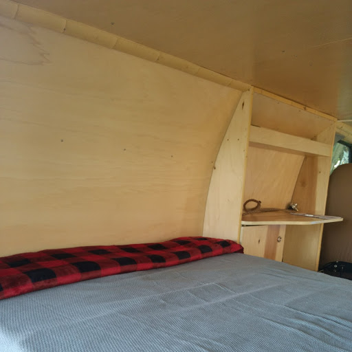 Writing table, cupboard with games, sunscreen, bug spray, toilet paper. Ford Van 2006