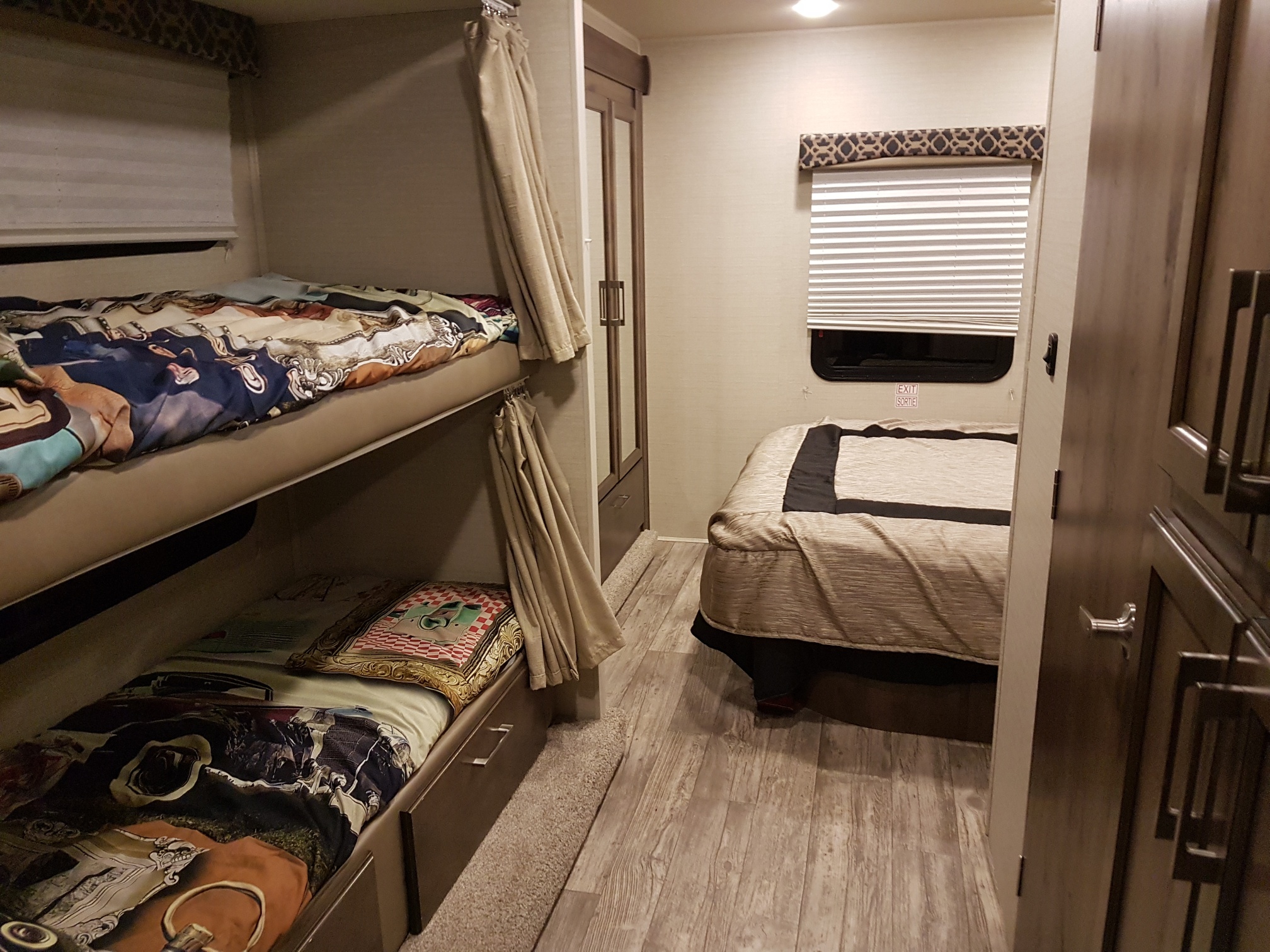 Inside this **rv rental**, discover comfortable bunk beds and a main bed in the bedroom area.. Jayco Redhawk 2018