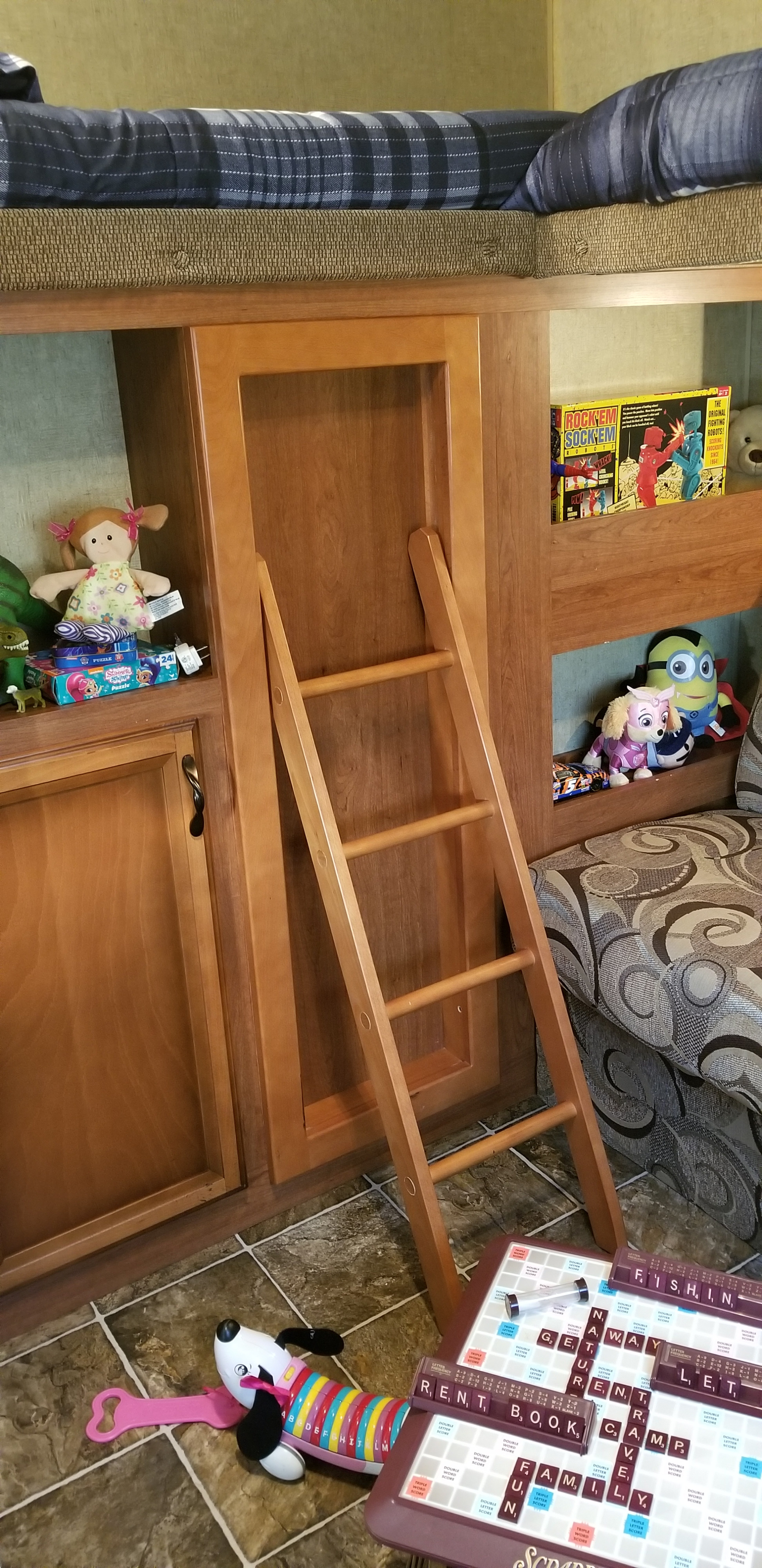 Inside an RV rental: cozy bunk beds, ladder, and kids' toys like Scrabble & Rock 'Em Sock 'Em Robots.. Other Other 2013