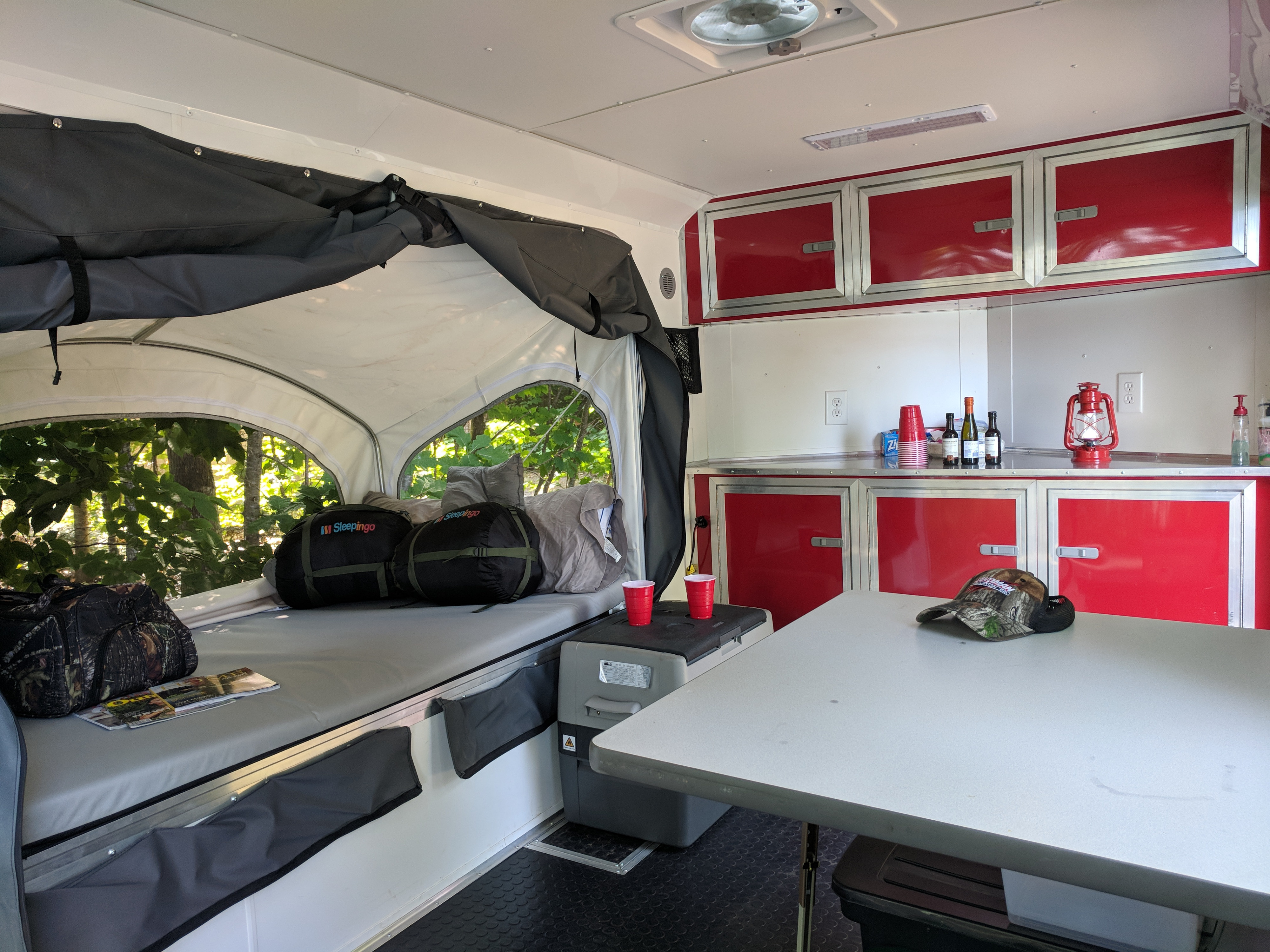 Spacious RV rental interior with sleeping area, kitchen, and ample storage, perfect for outdoor adventures.. United XLMTV-610 2018