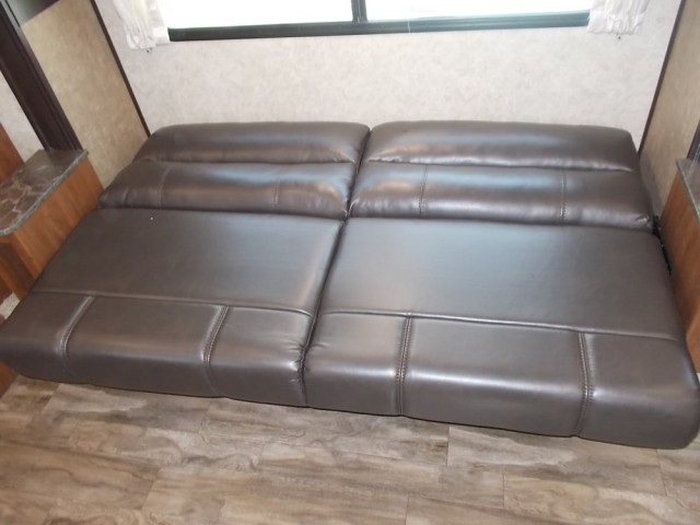 This RV rental features a practical brown sofa bed, fully extended to provide extra sleeping space.. Jayco Jay Feather 2018