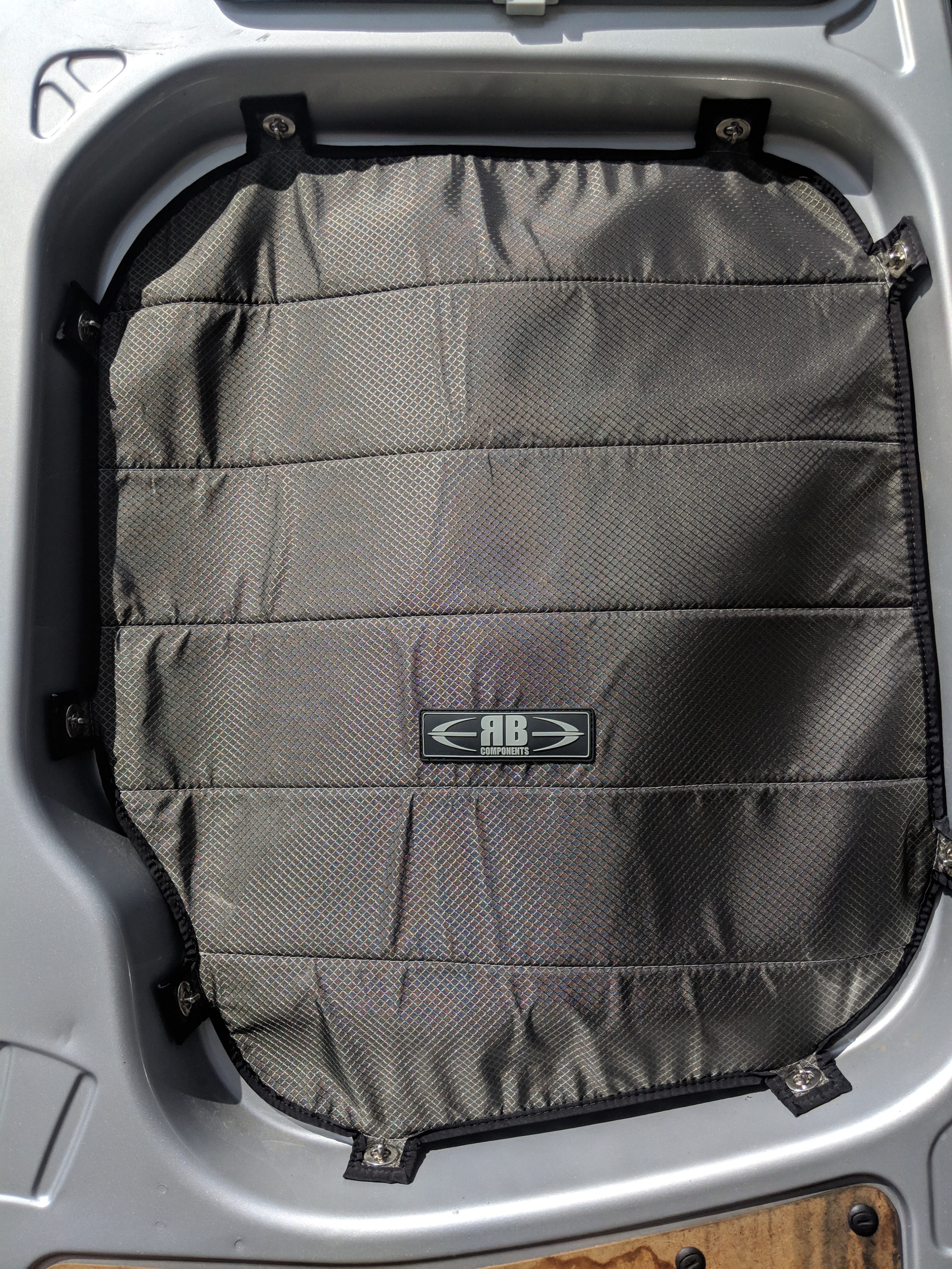 RB Components insulated window cover installed in an RV rental, offering enhanced privacy and climate control.. Mercedes-Benz Sprinter 2016