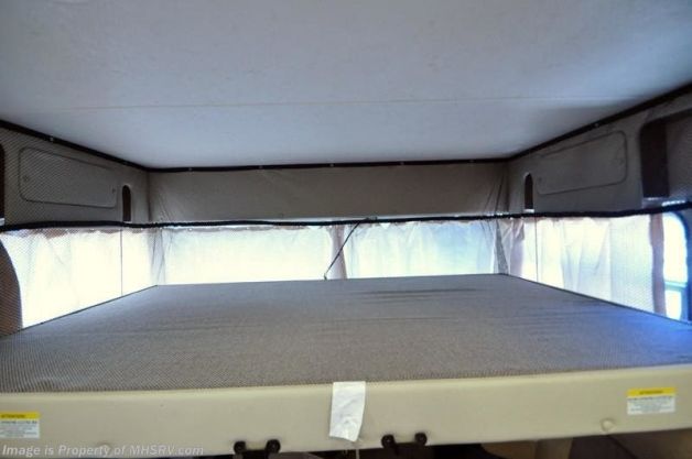 RV rental: Inside, a comfortable cab-over bunk sleeping area with mattress, safety netting & curtains.. Forest River Coachmen Pursuit 2023