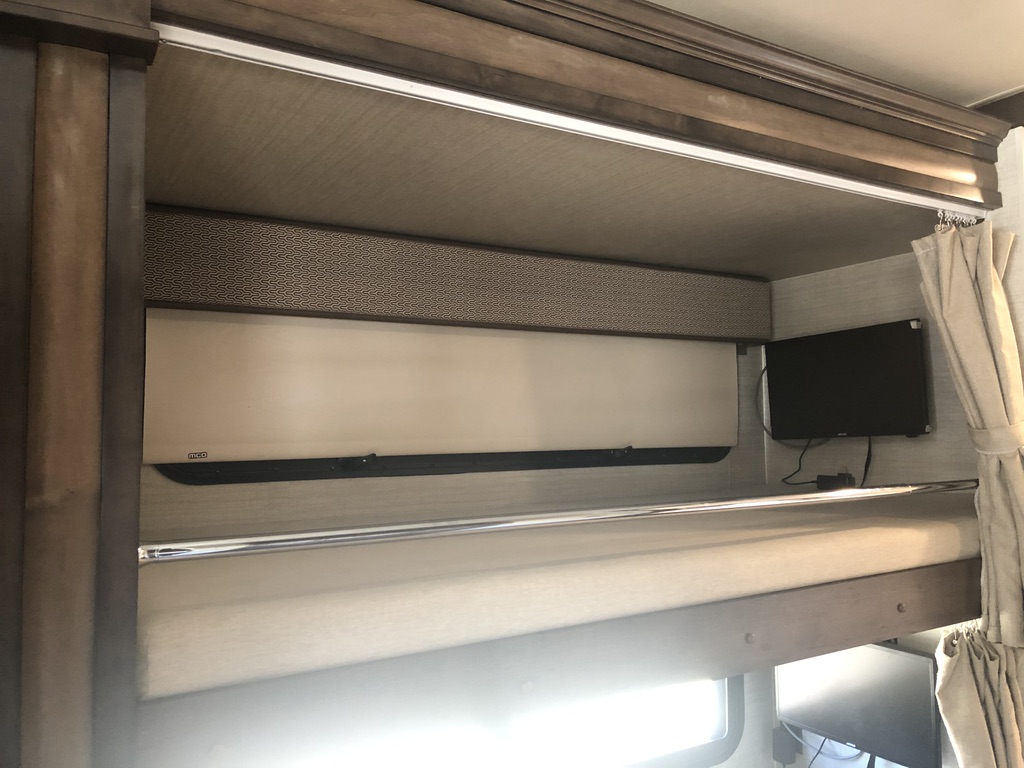 Upper Bunk (each bunk has it's own tv w/dvd player w/hdmi hookup, light, window, privacy shades, and wall outlet). Entegra Coach Emblem 2019