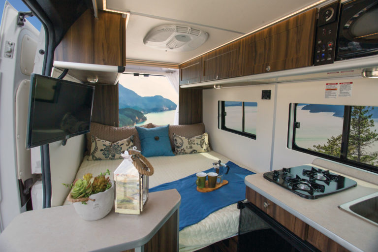 This RV rental offers a compact yet comfortable interior. Enjoy a bed, kitchen, TV, and breathtaking lake views on your adventure.. Hymer Carado Banff 2018