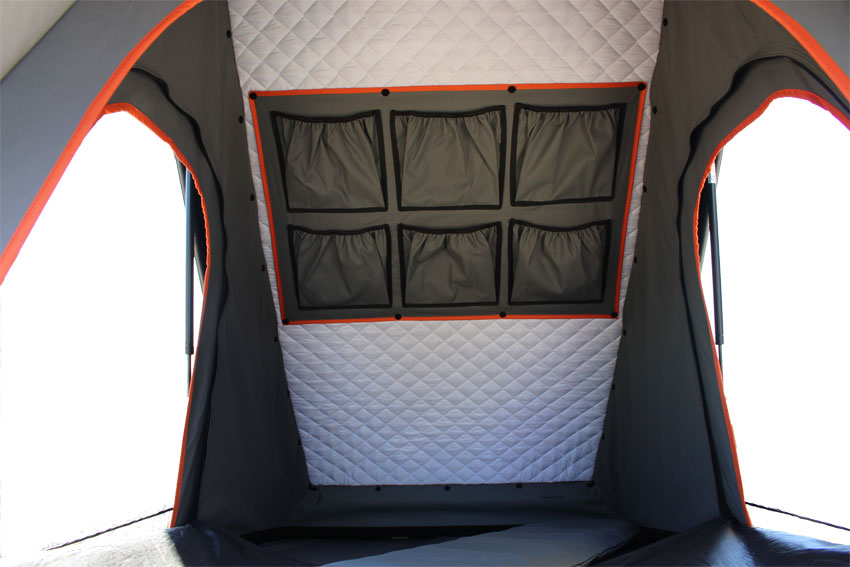 Inside an RV rental tent: Quilted insulation and six gear pockets offer organized comfort for camping adventures.. Toyota 4Runner 2022