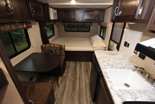 RV rental: view of a compact interior with a bed, dinette seating, and small kitchen with a sink.. Jayco Jay Flight 2018