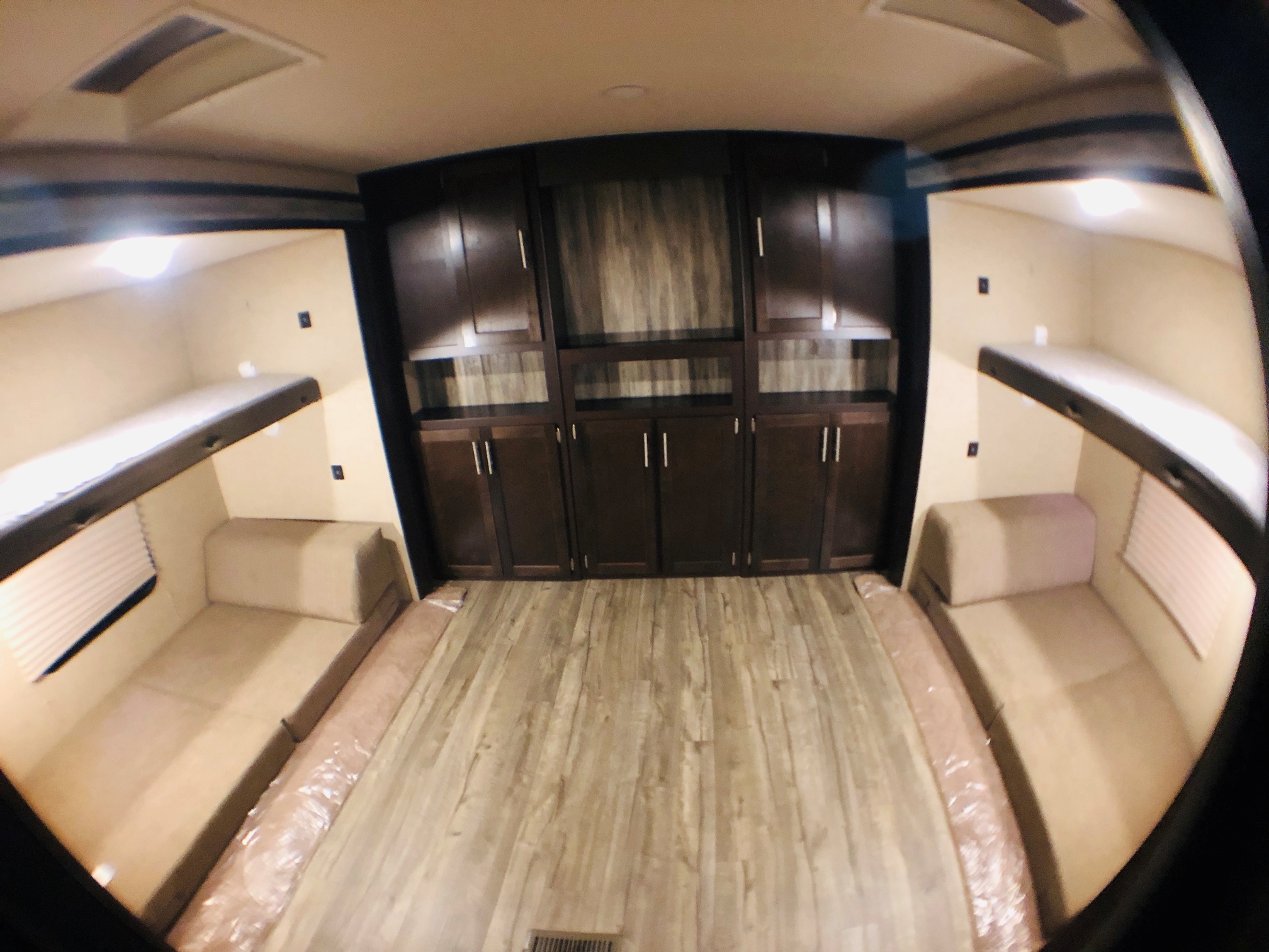 Spacious RV rental interior featuring bunk beds, convertible sofas, and ample storage cabinets.. Forest River Cherokee 2019