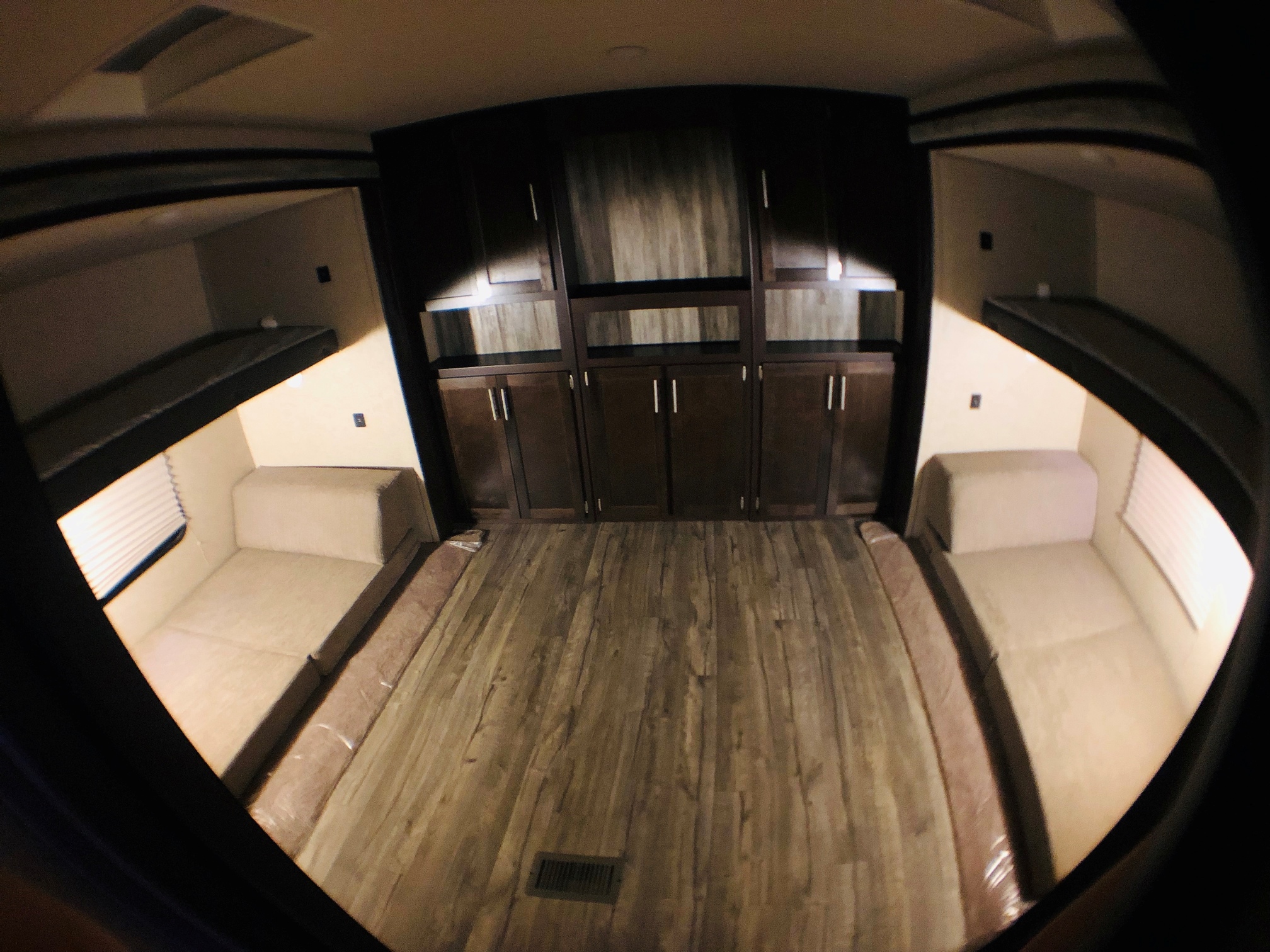 Spacious RV rental interior with convertible beds, bunks, and ample storage cabinetry, ideal for travel.. Forest River Cherokee 2019