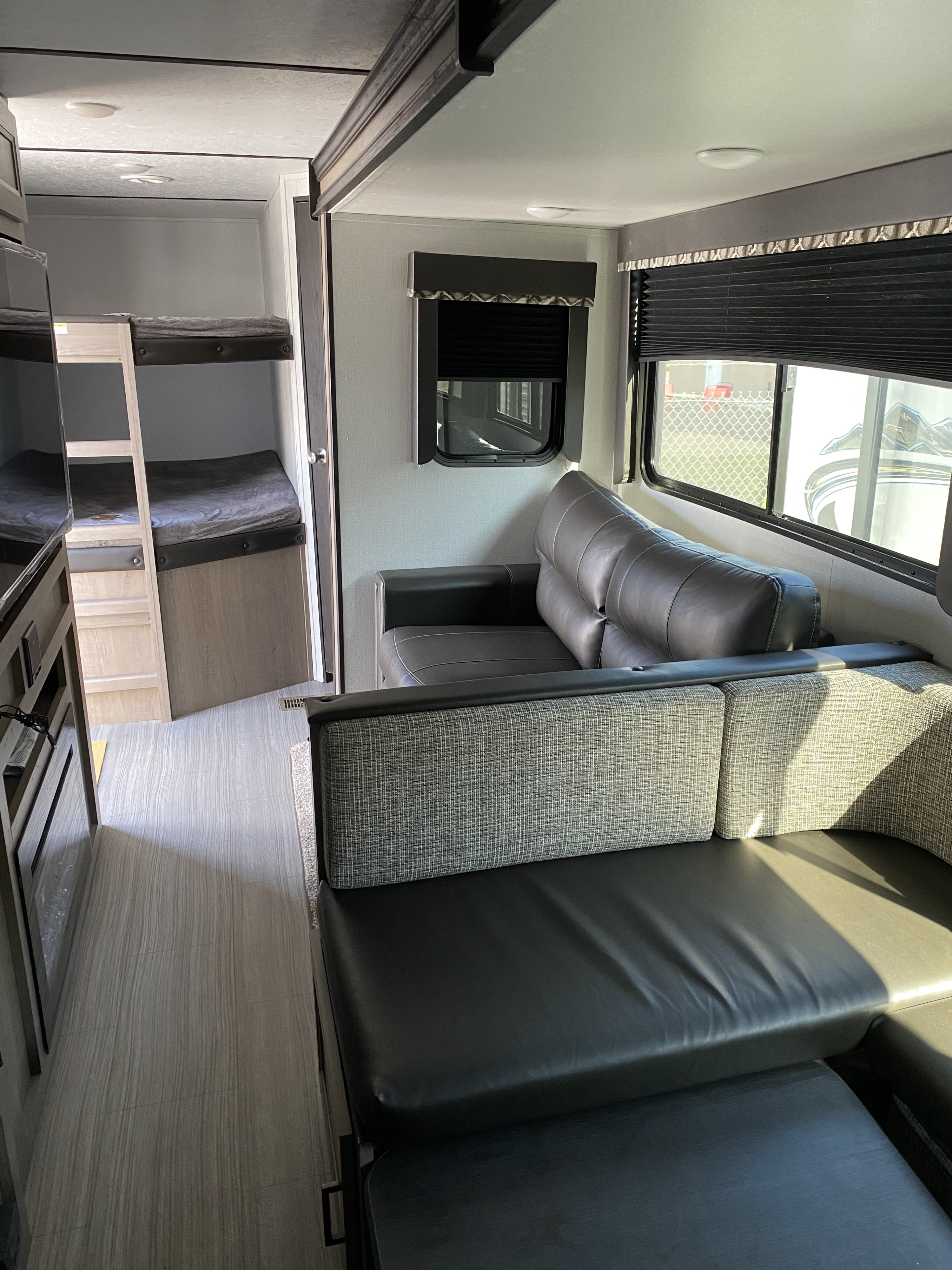 RV rental: Modern interior with comfy sofa, bunk beds, and a bright living area.. Keystone Hideout 2020