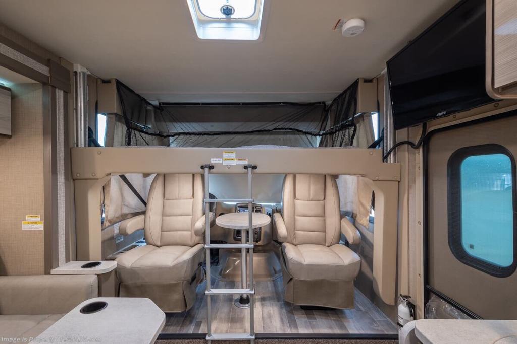 Explore this RV rental's versatile interior: cab-over bunk, swiveling driver seats, and comfortable living space.. Thor Motor Coach Vegas 24.1 2020