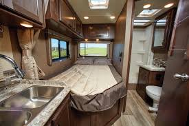 Step inside this RV rental! Features include a kitchen with sink, cozy bed, and private bathroom. Enjoy the views outside.. Thor Freedom Elite 2020