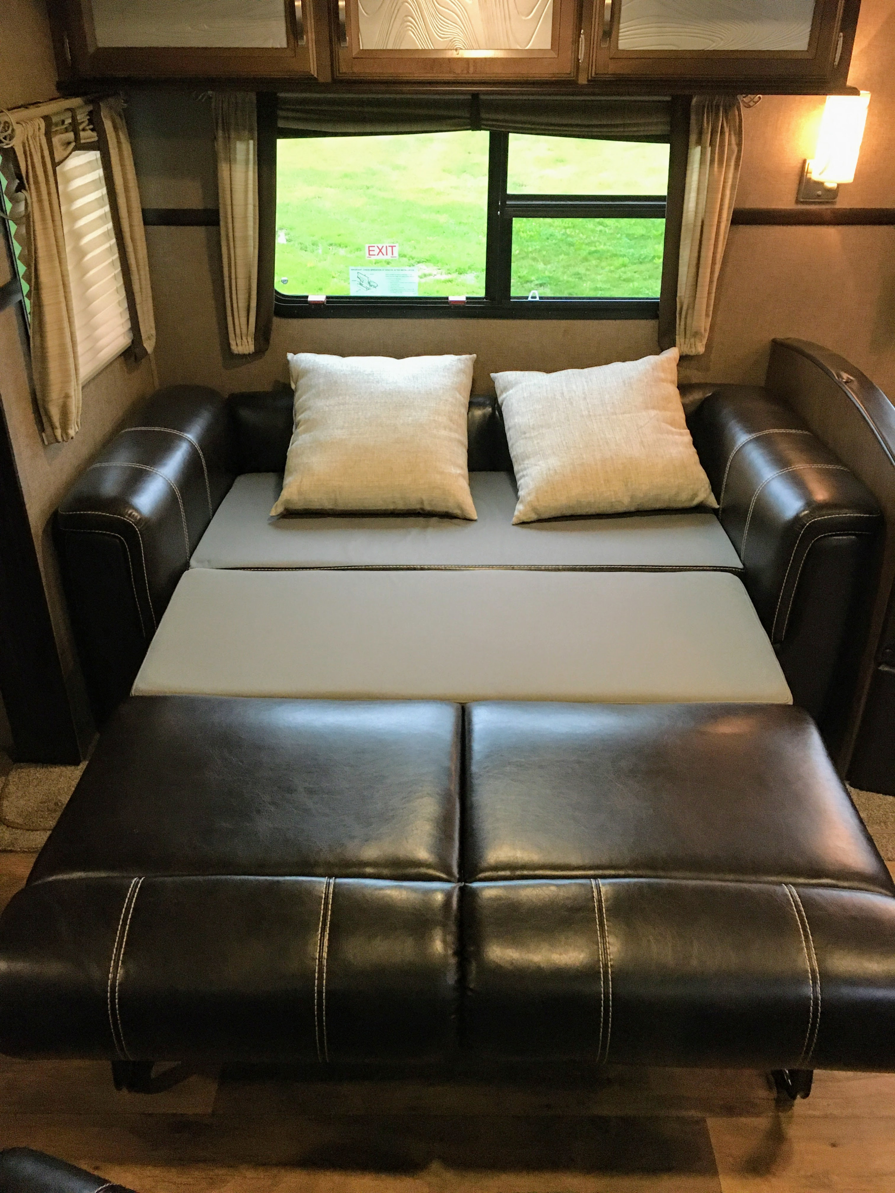 RV rental: Versatile sofa converts to a bed in this cozy interior, featuring large windows and overhead storage.. Forest River Salem Hemisphere 2017