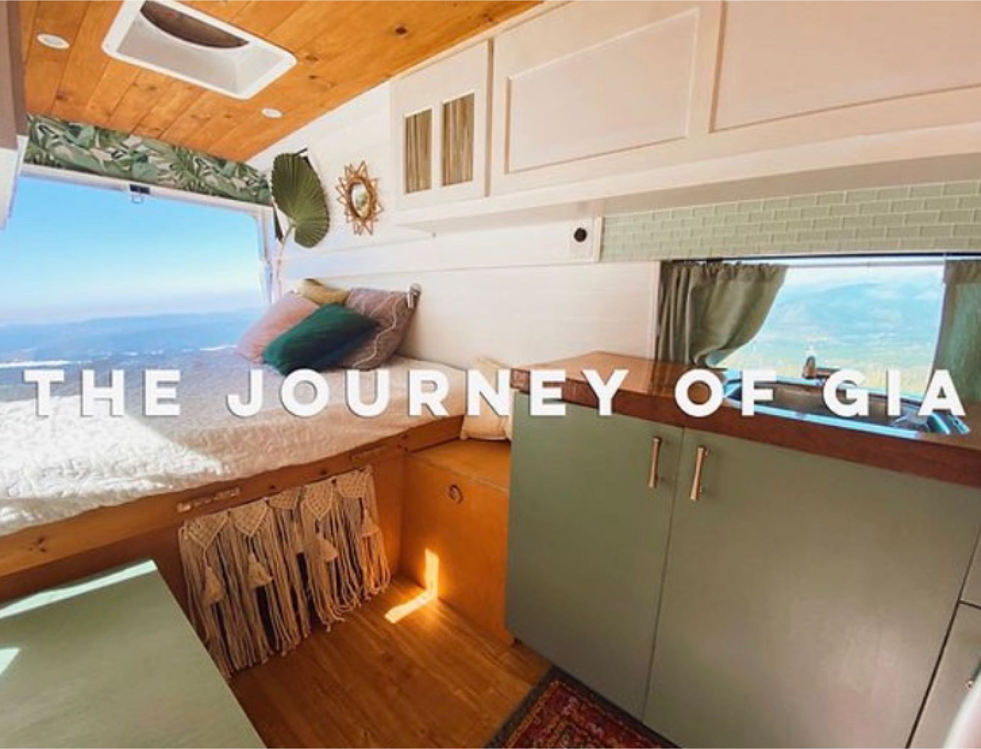 Cozy RV rental interior with bed, kitchen, and stunning mountain views. Ideal for your next van life adventure.. Ford E150 Chariot Hi-Top Conversion 2009