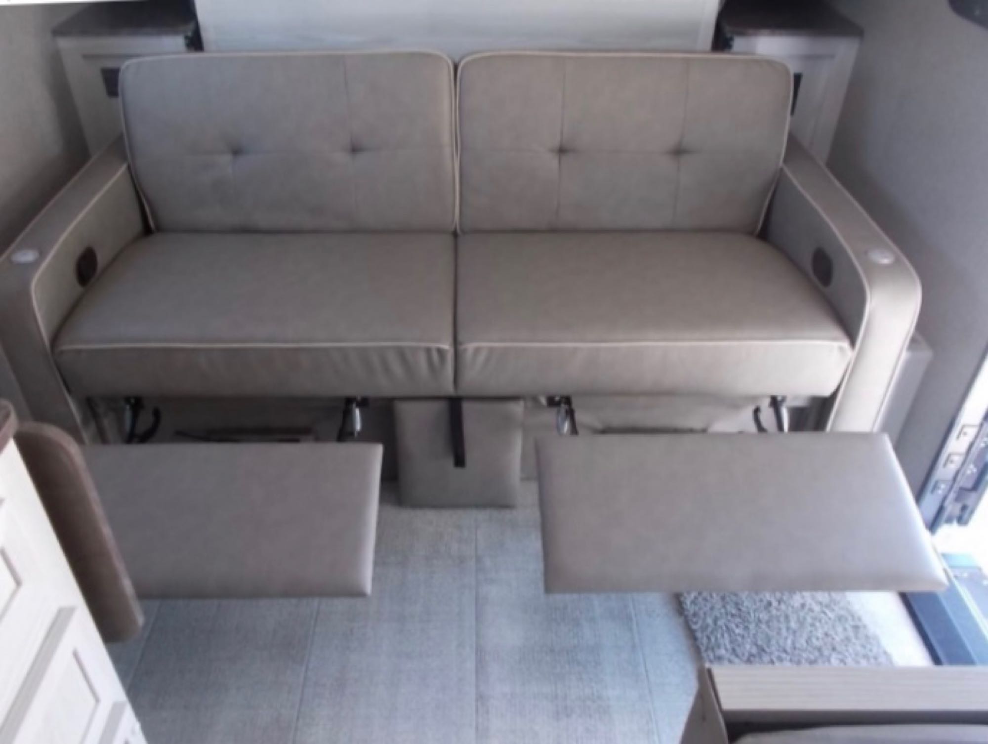 Relax in this RV rental's reclining two-seater sofa with cup holders. Enjoy comfy travel living.. Forest River Rockwood Geo Pro 2021