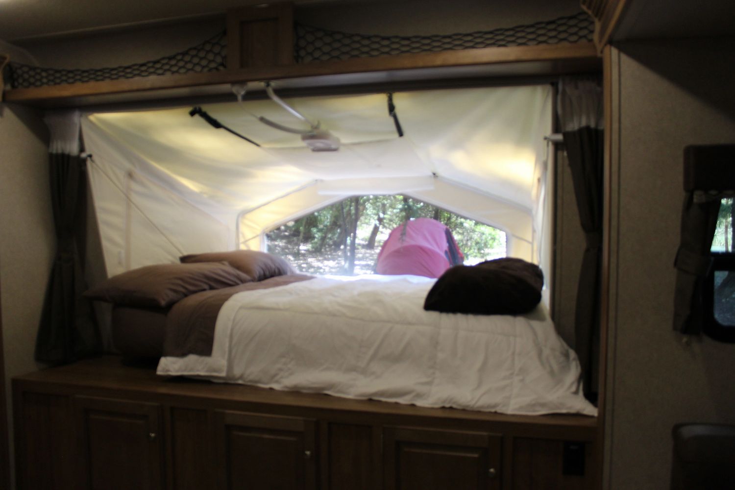 Front Sleeping Area Windows open.  Queen size mattress.  Mattress can be plugged inand heated.  Curtains can be closed for privacy.  . Forest River Rockwood Roo FL 2018