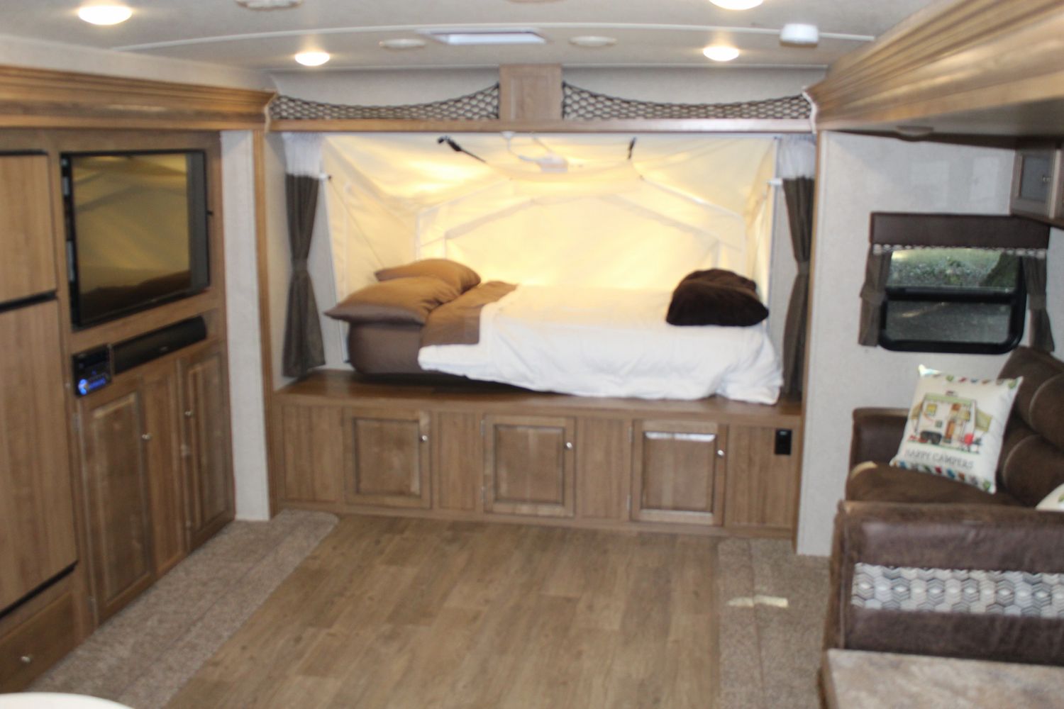 Front Sleeping Area Windows Closed.  Queen size mattress.  Mattress can be plugged in and heated.  Curtains can be closed for privacy.  . Forest River Rockwood Roo FL 2018