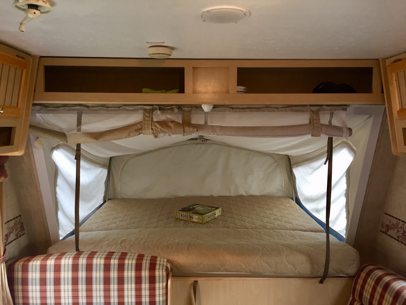 Inside this RV rental, find a comfortable pop-out bed with a board game, ideal for your next camping adventure.. Jayco Other 2004