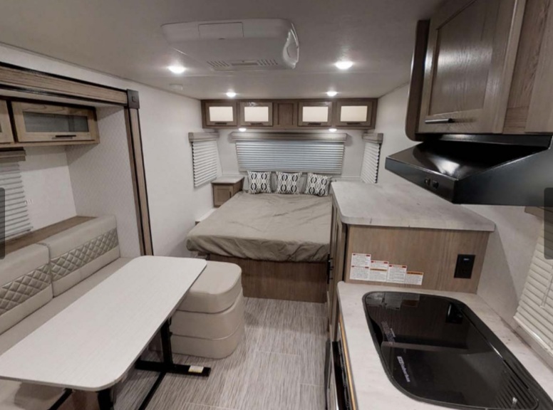 The bed has space and storage on each side. no climbing into this one from the end. The kitchen table also can convert into a small bed.. Forest River Other 2019